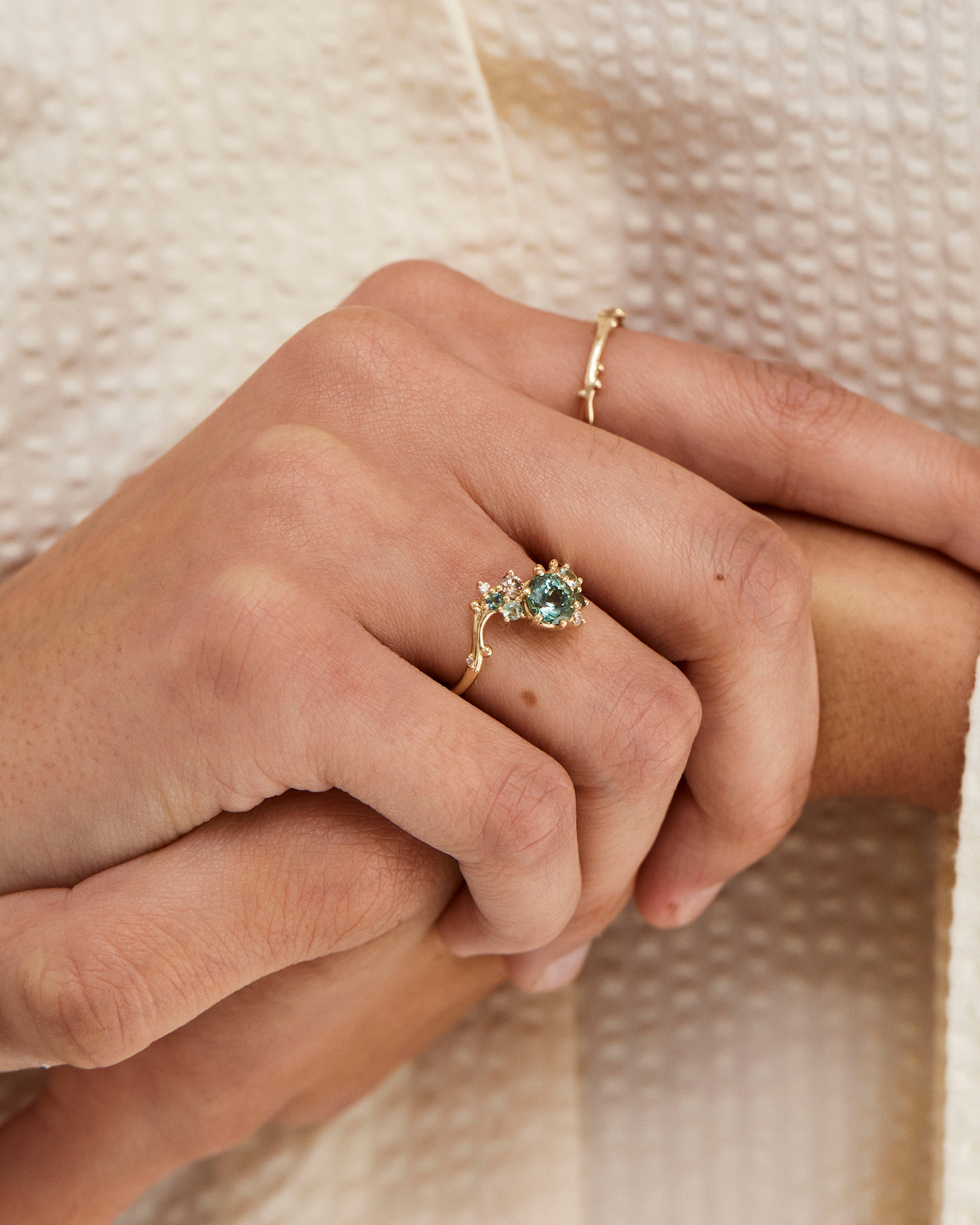 A woman's hand showcasing the Liana | Cluster Ring | Sapphires.