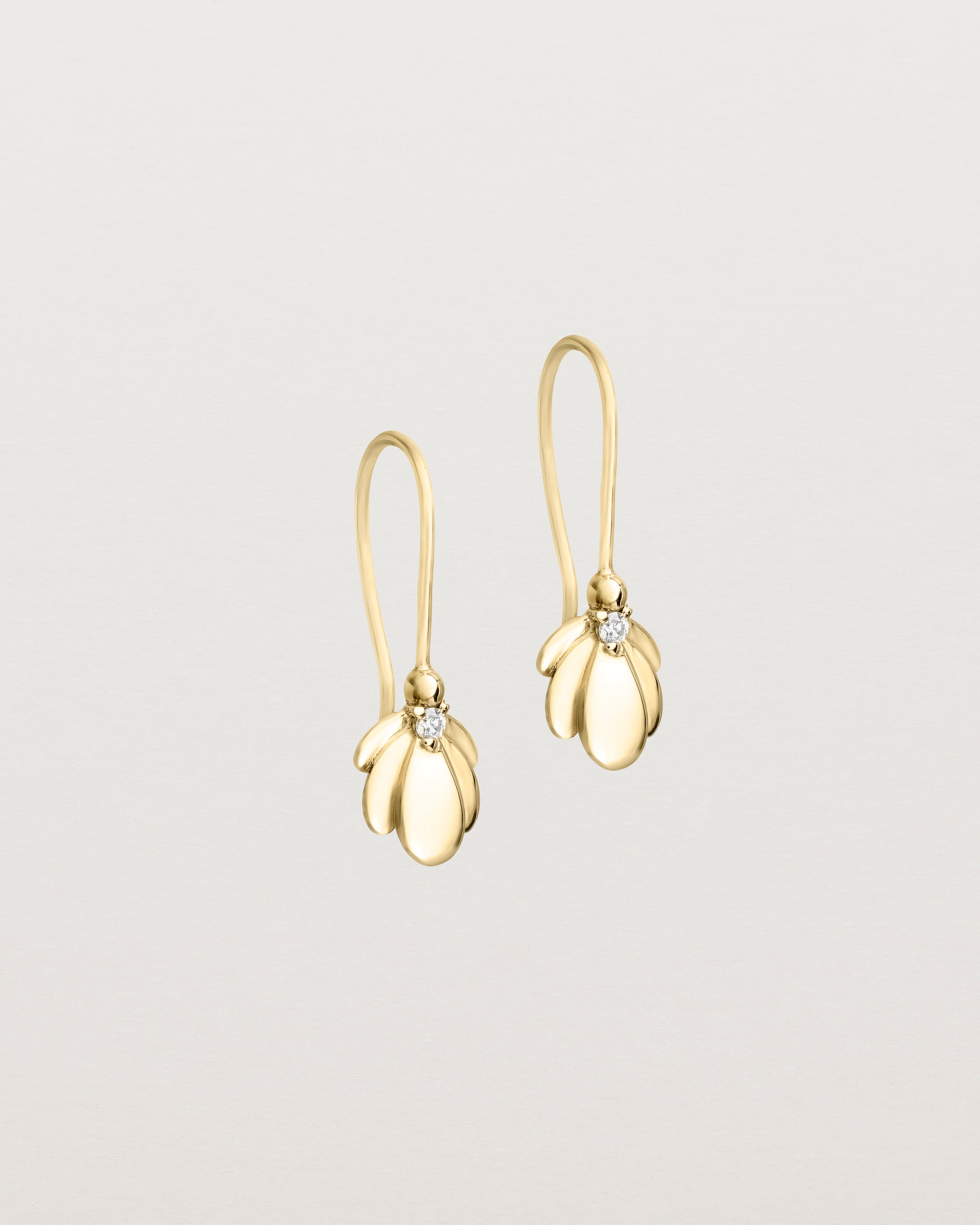 Angled view of the Aeris Earrings | Diamond | Yellow Gold