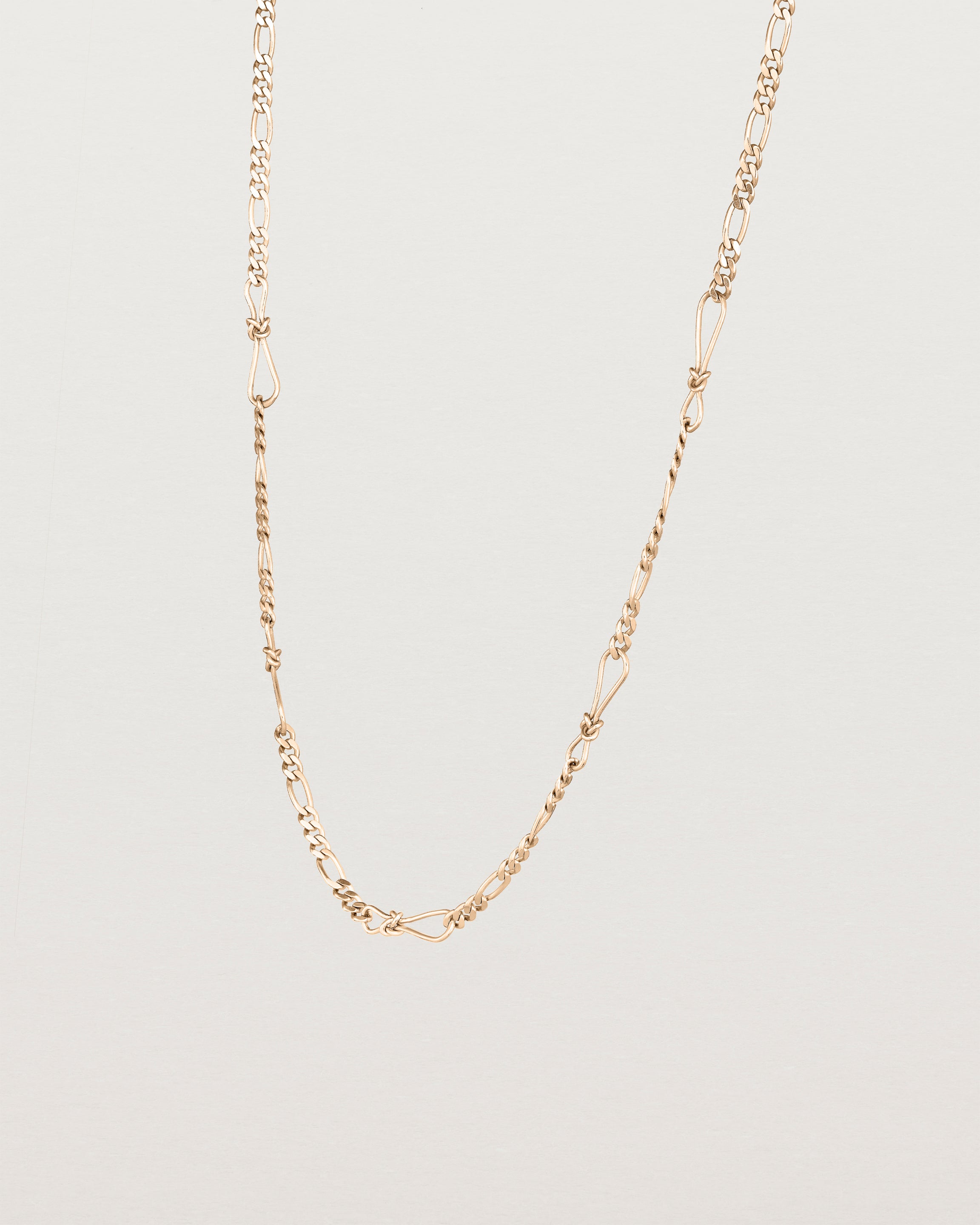 Angled view of the Anam Charm Necklace in Rose Gold.