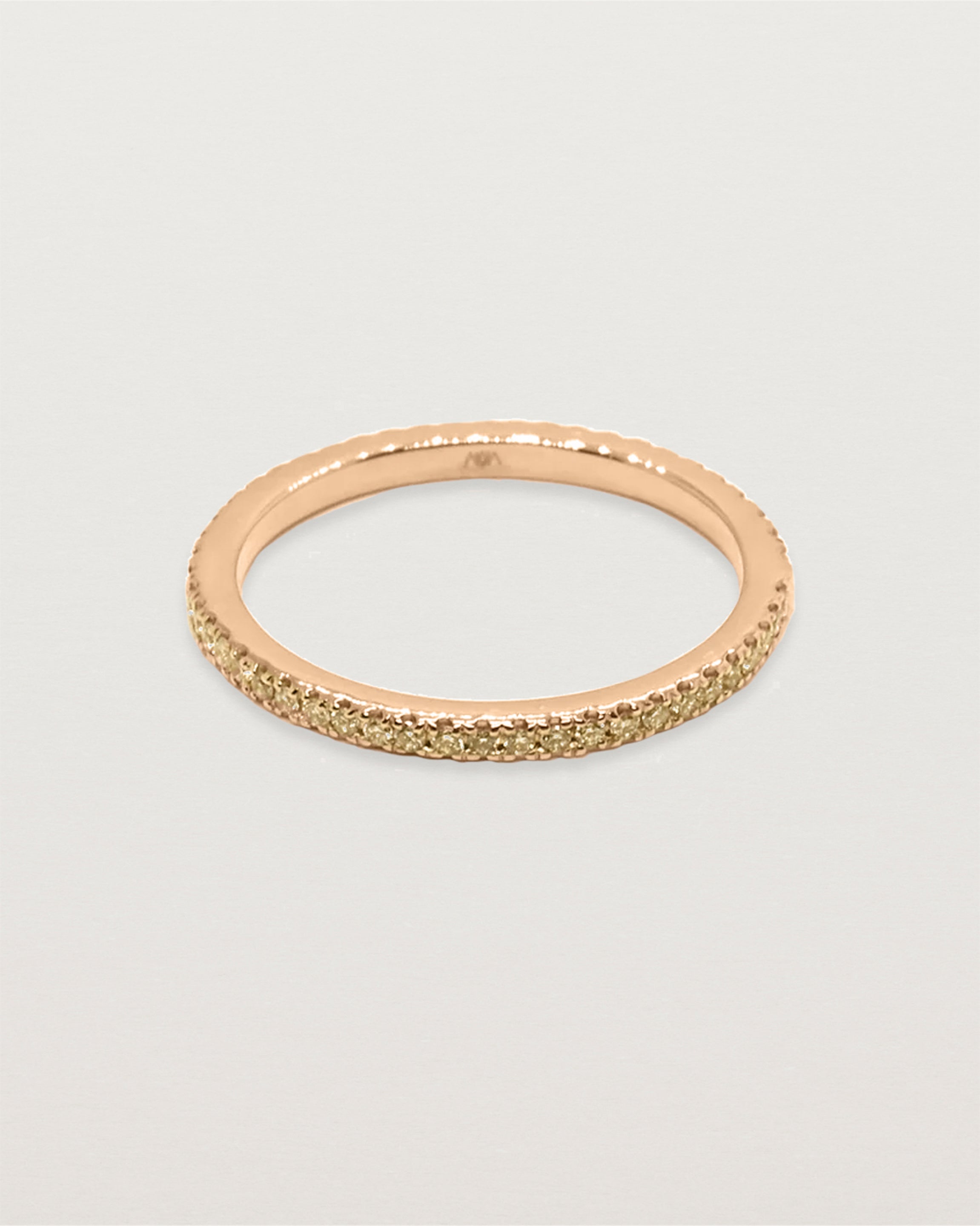 rose gold band featuring micro pave champagne diamonds