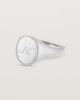 Angled view of the Arden Signet Ring | Millgrain in white gold.