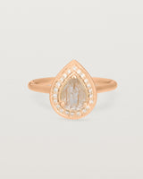 Front view pear halo ring featuring a pear cut rutilated quartz stone and a halo of white diamonds in rose gold