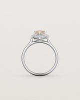 Standing view pear halo ring featuring a pear cut rutilated quartz stone and a halo of white diamonds in white gold