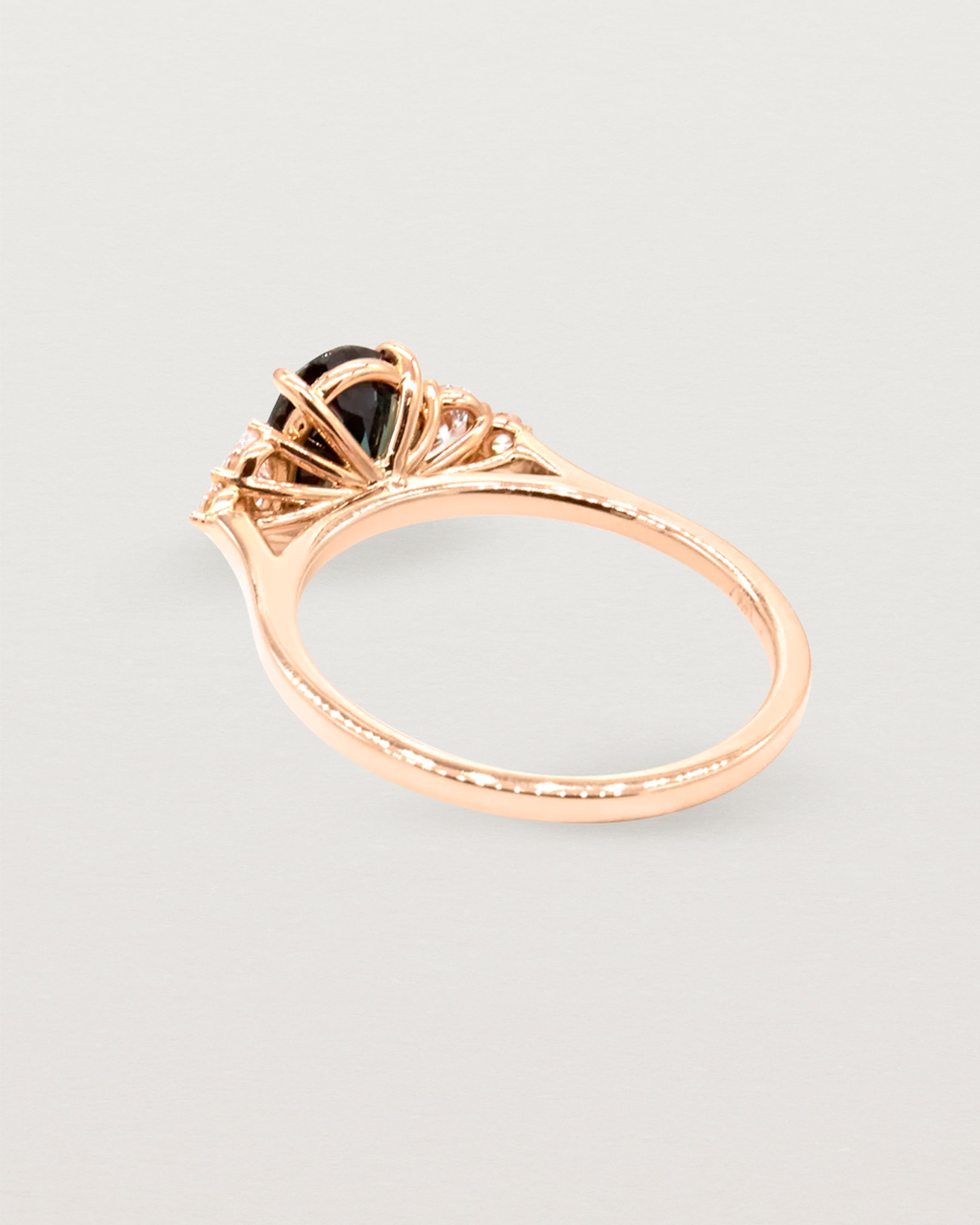 Back view of a cluster ring in rose gold