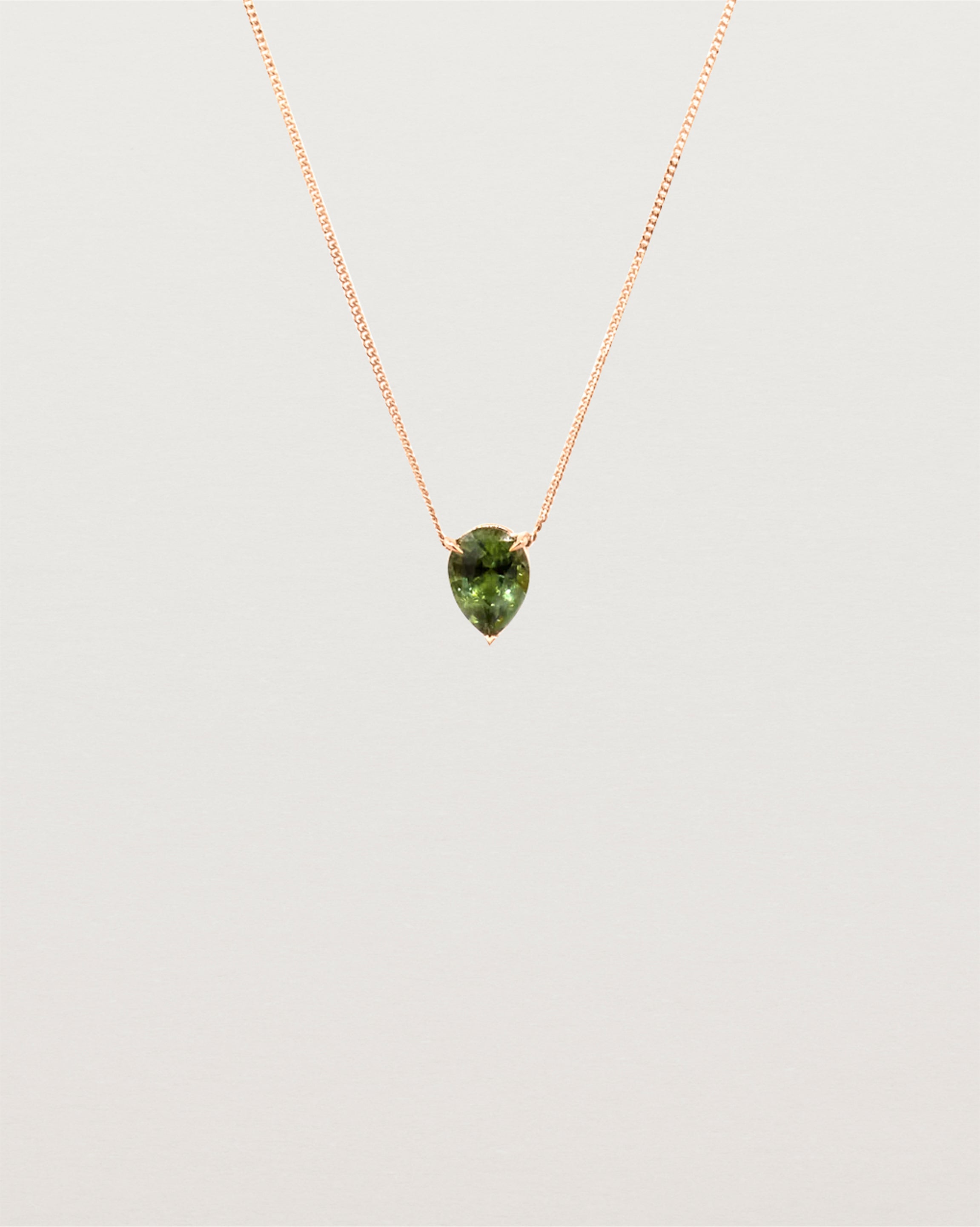 A Madagascan pear sapphire, is set in our classic slider pendant design. 
