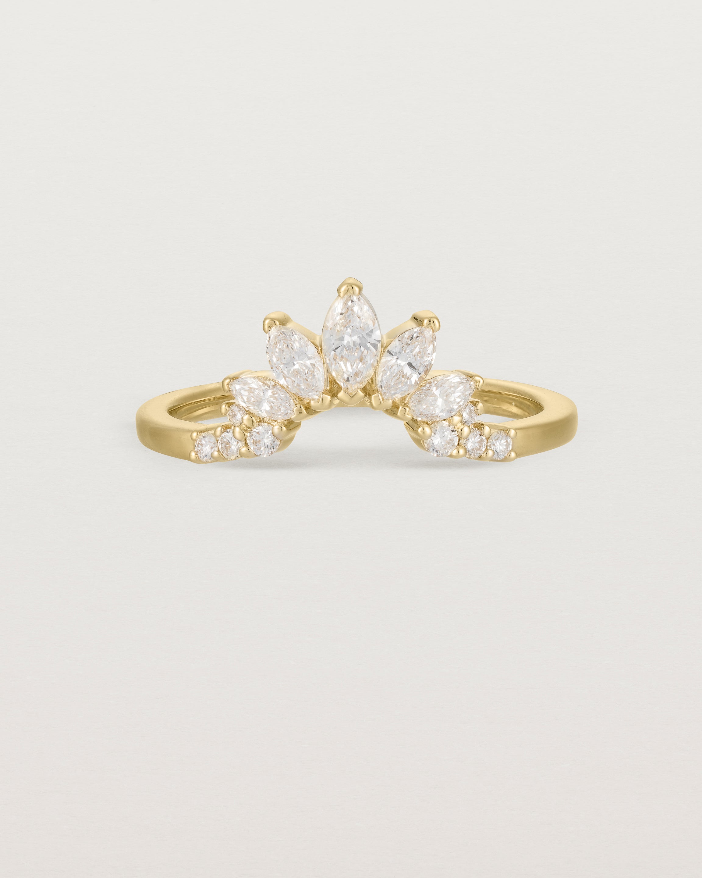 Size three of a sun-bream inspired white diamond crown ring, crafted in yellow gold