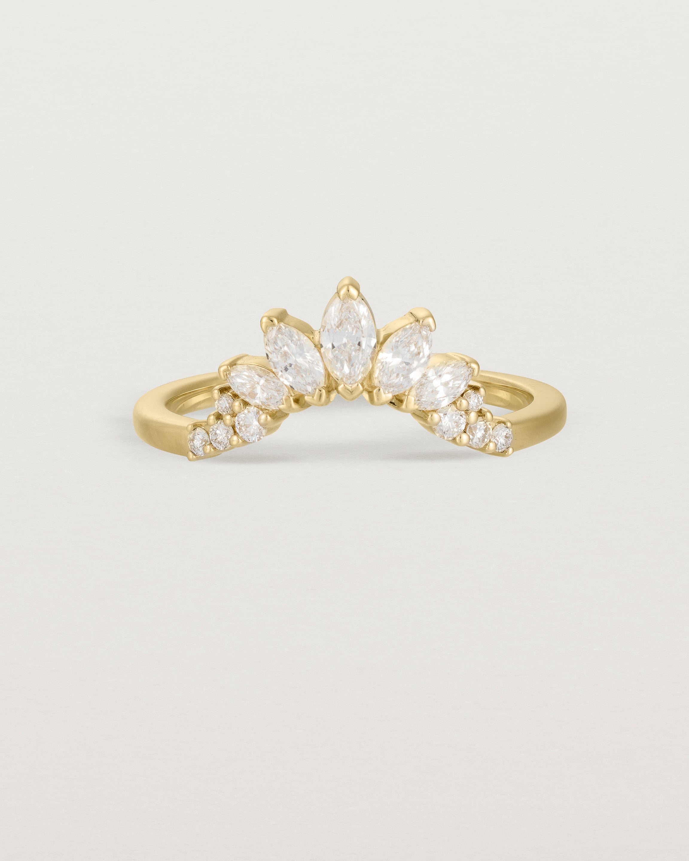 Size four of a sun-bream inspired white diamond crown ring, crafted in yellow gold