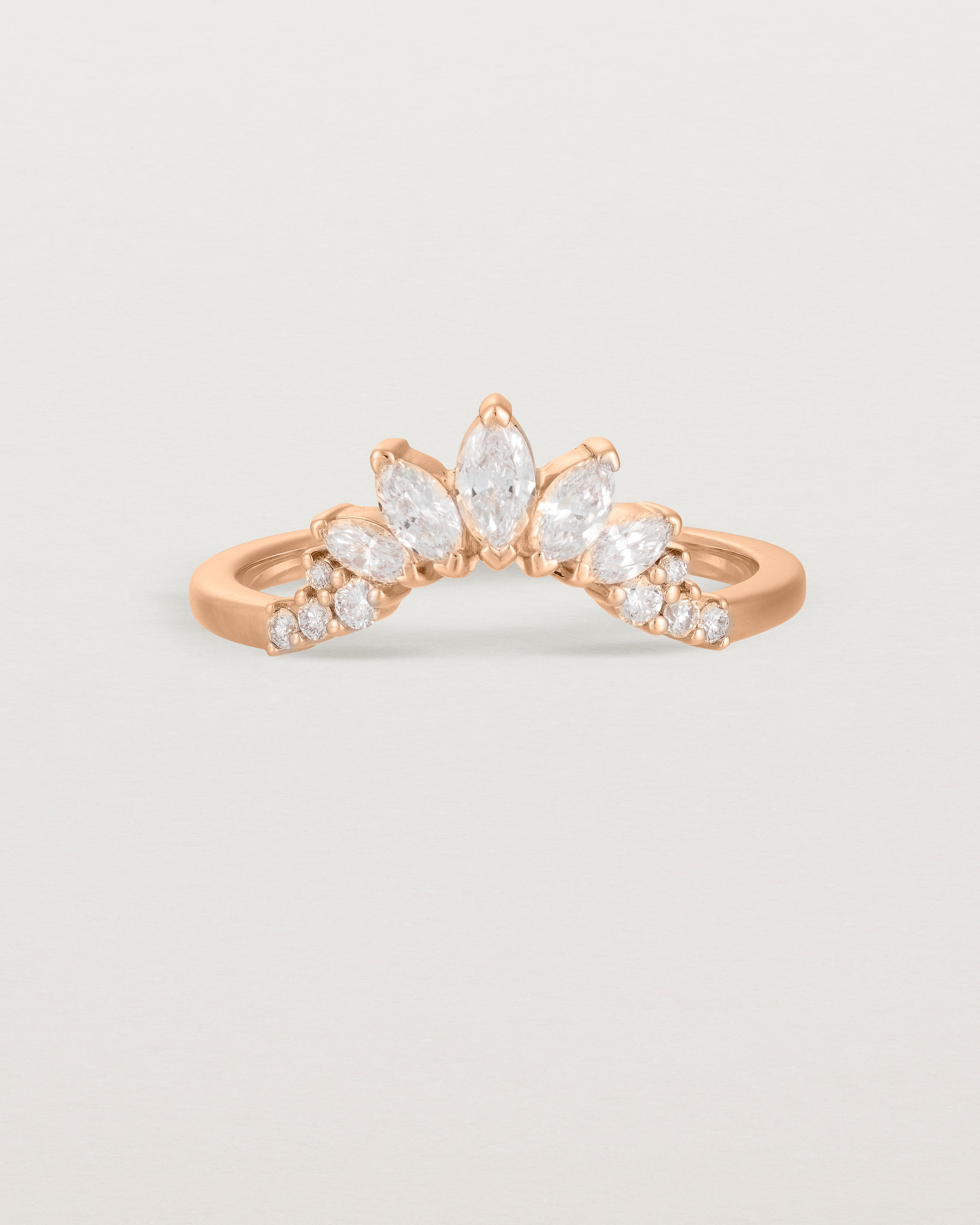 Size four of a sun-bream inspired white diamond crown ring, crafted in rose gold