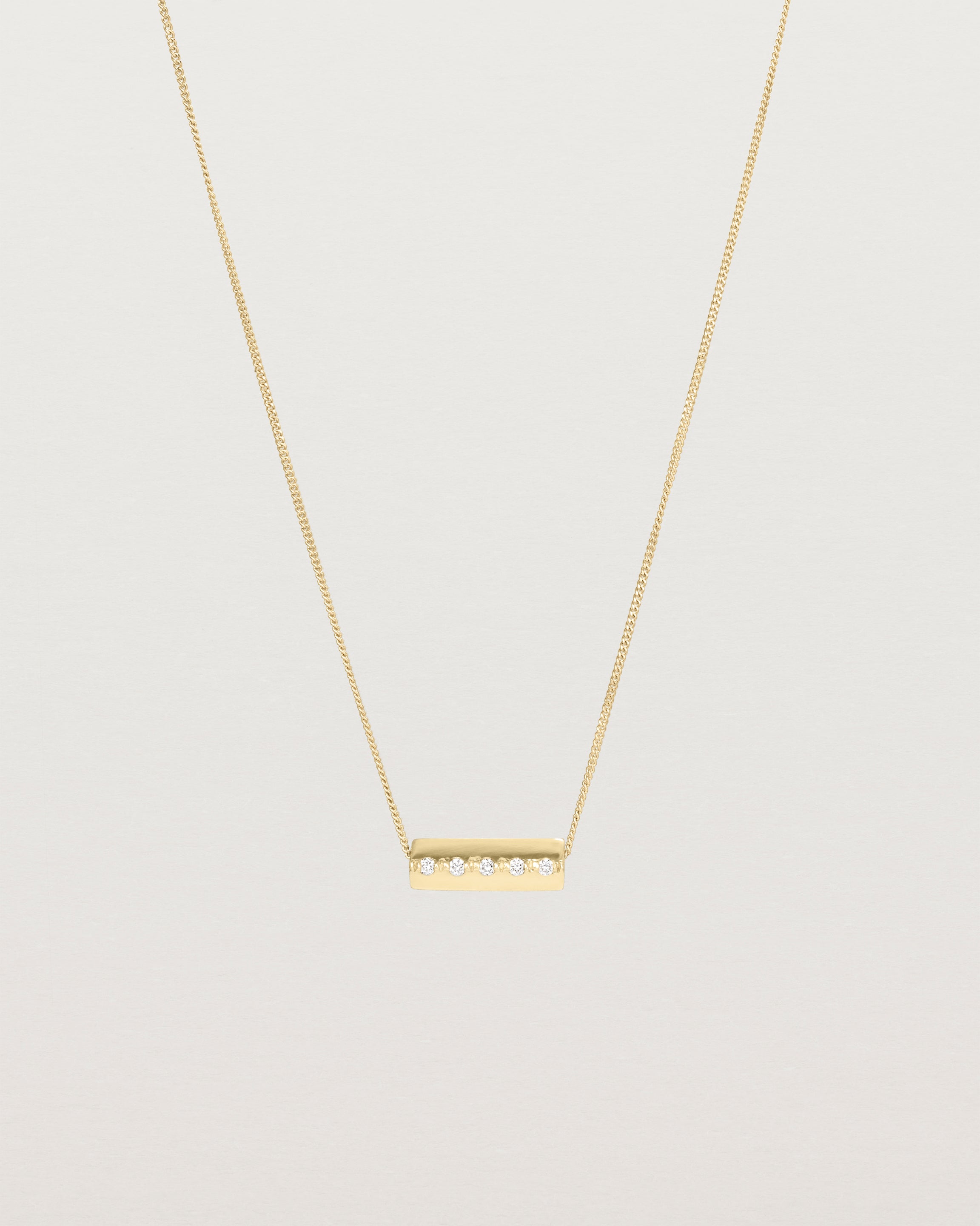 Front view of the Cascade Knife Edge Necklace | Diamonds in yellow gold.