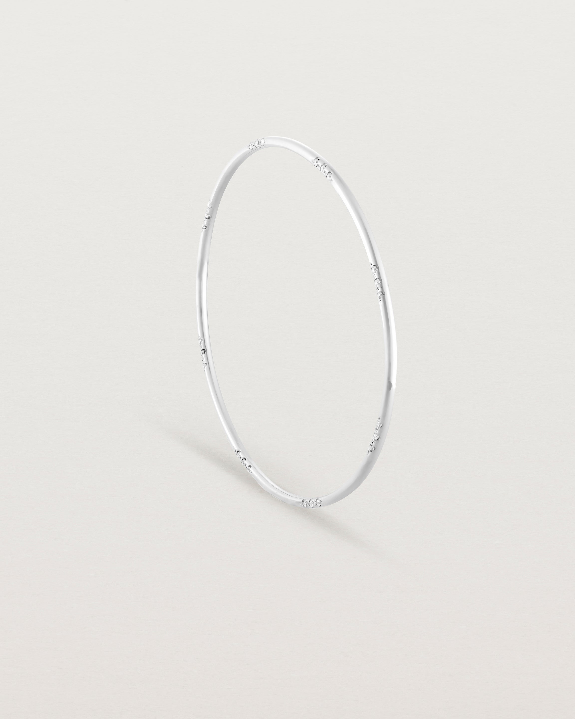 Standing view of the Cascade Oval Bangle | Diamonds | White Gold