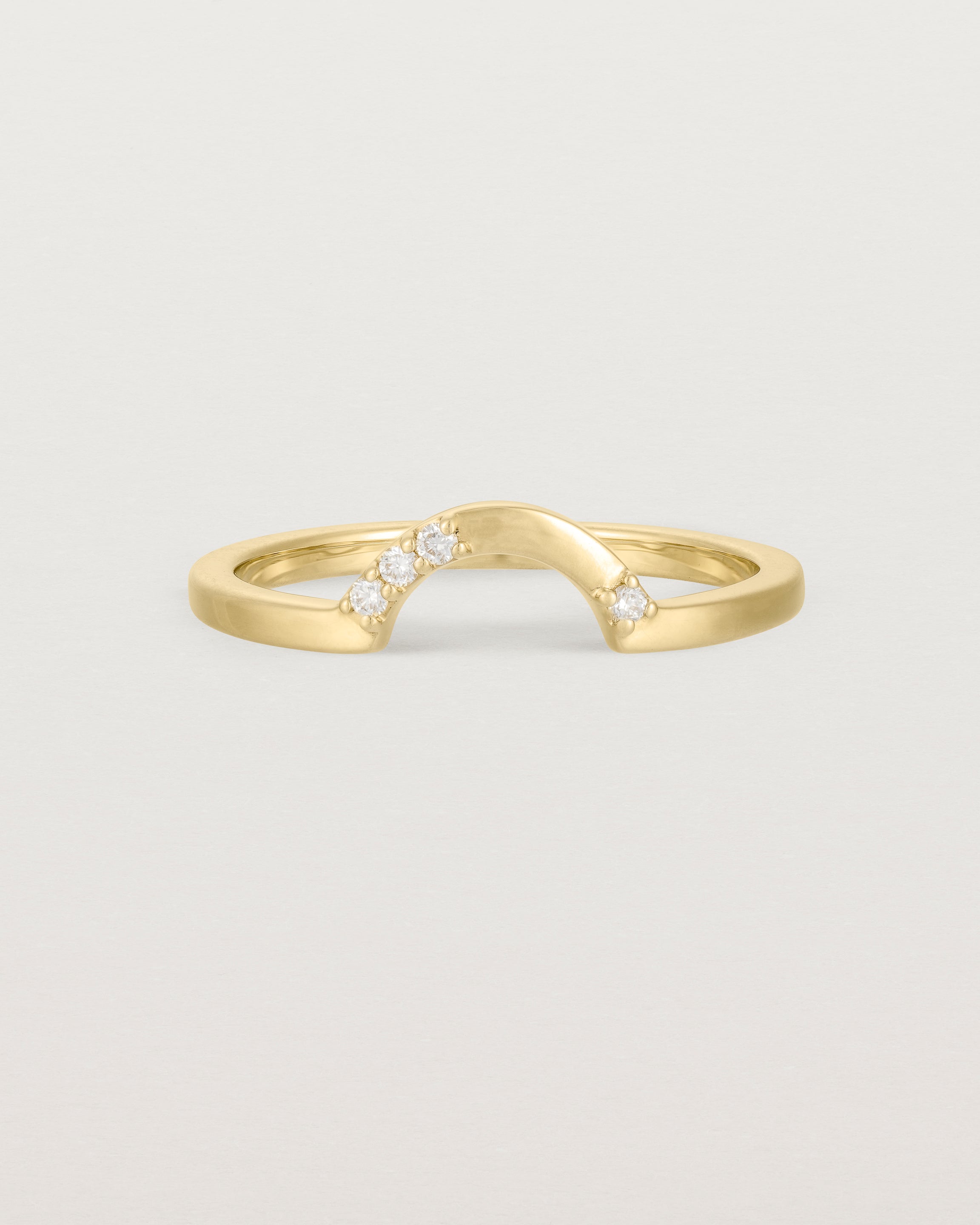 Fit two of a classic arc ring featuring scattered white diamonds, crafted in yellow gold