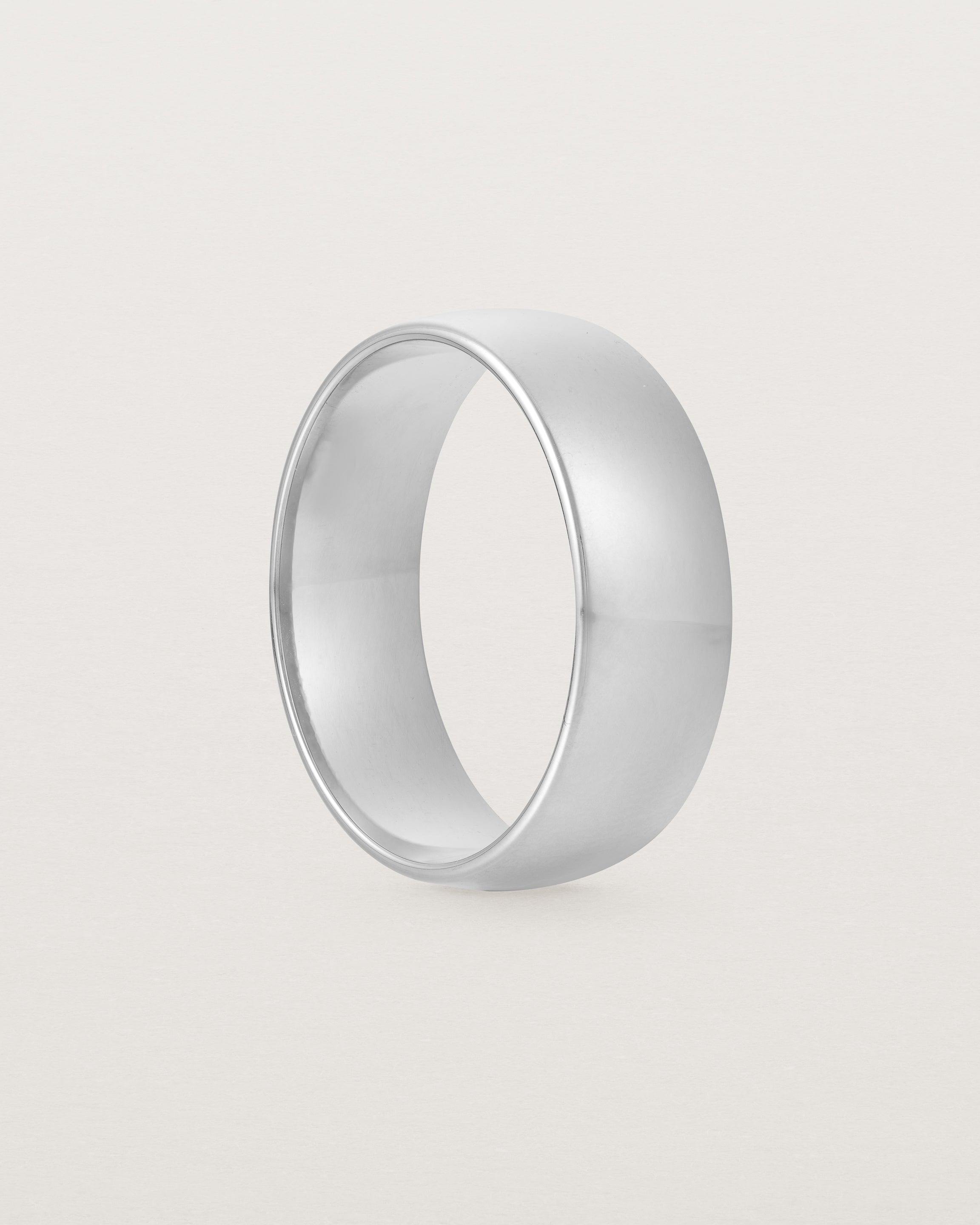 The side view of a heavy 7mm wedding band in white gold