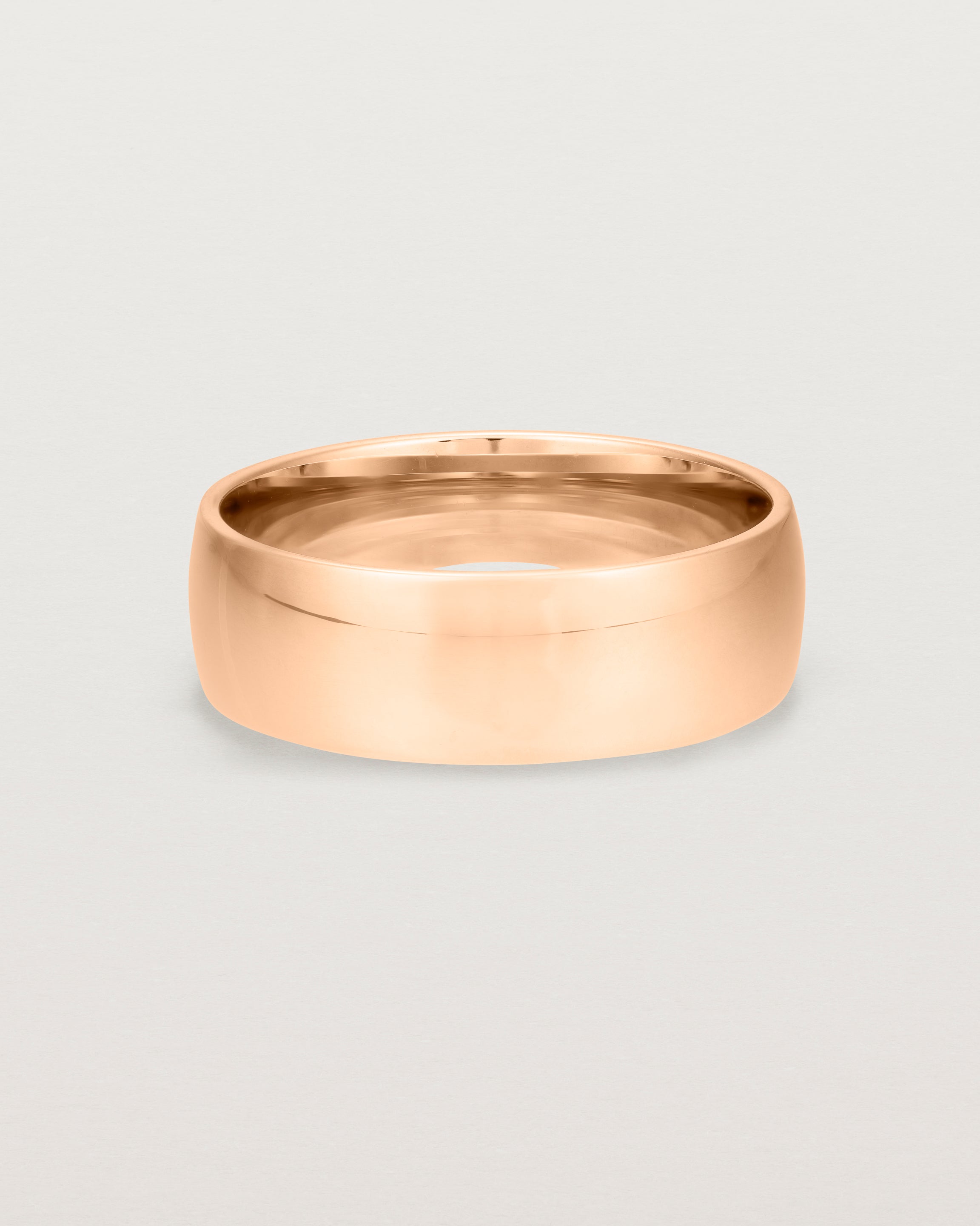 The front view of a heavy 7mm wedding band in rose gold