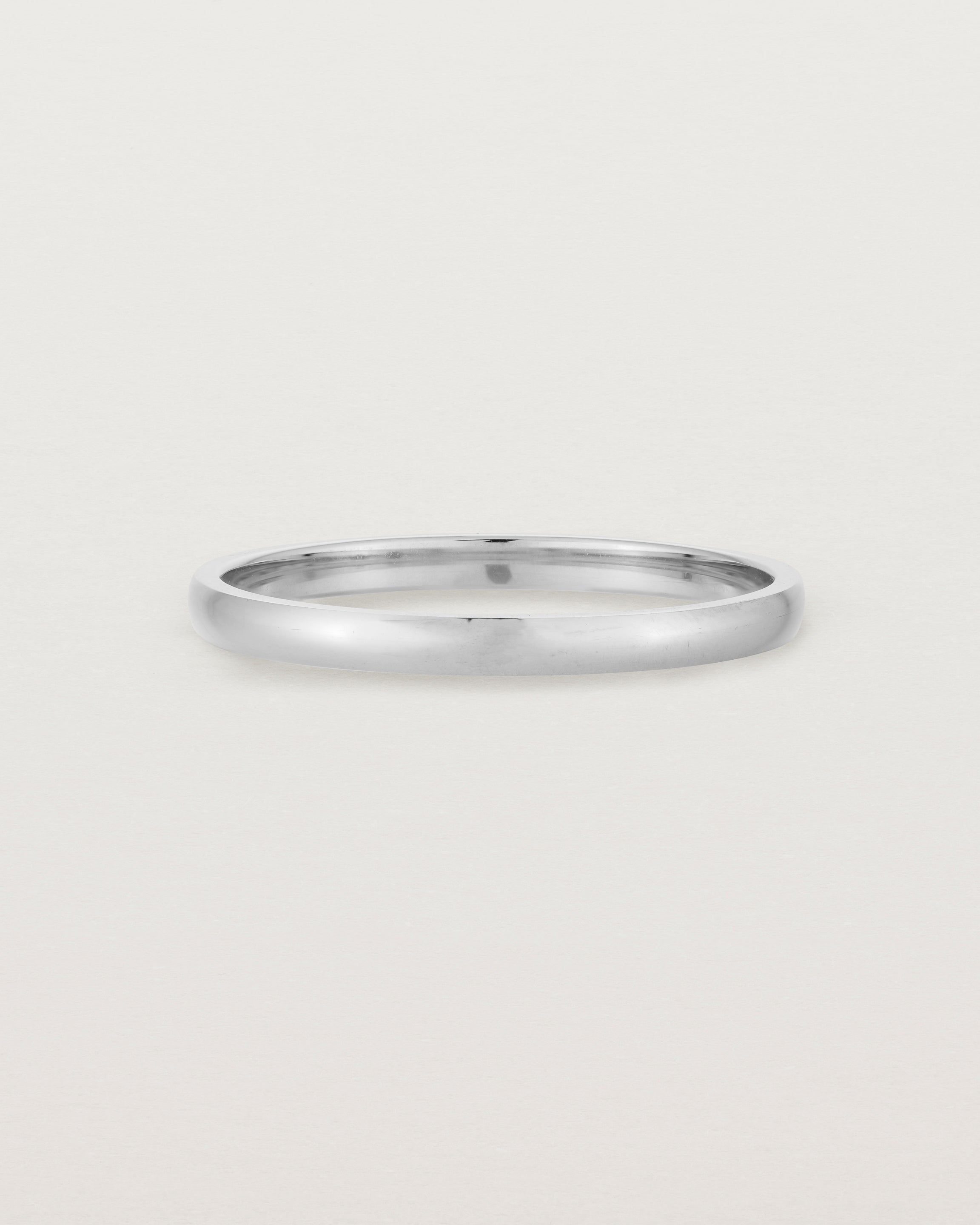 A fine, classic wedding band in white gold