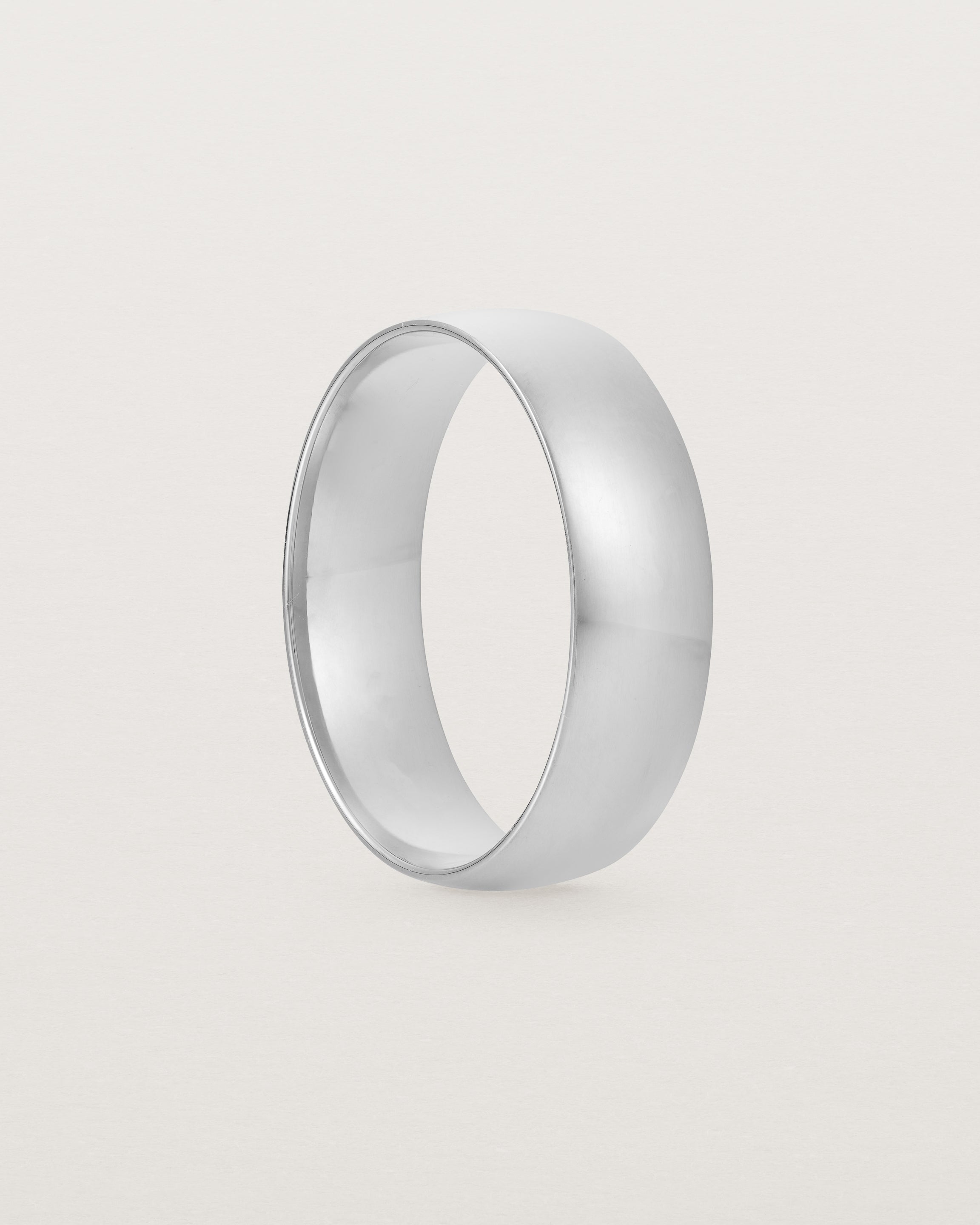 A bold 6mm wedding band crafted in white gold