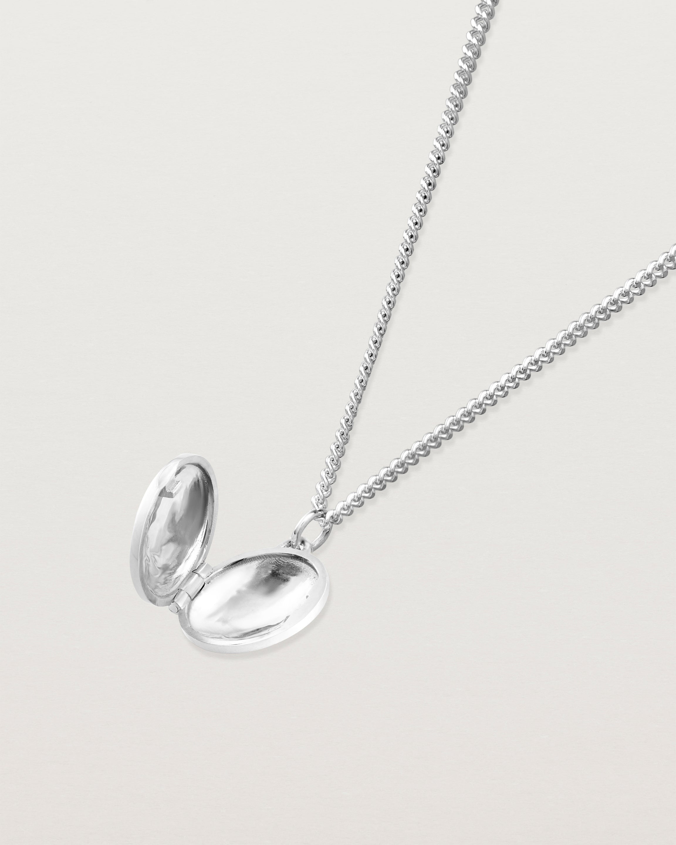 Open view of the Clematis Vine Locket in sterling silver.