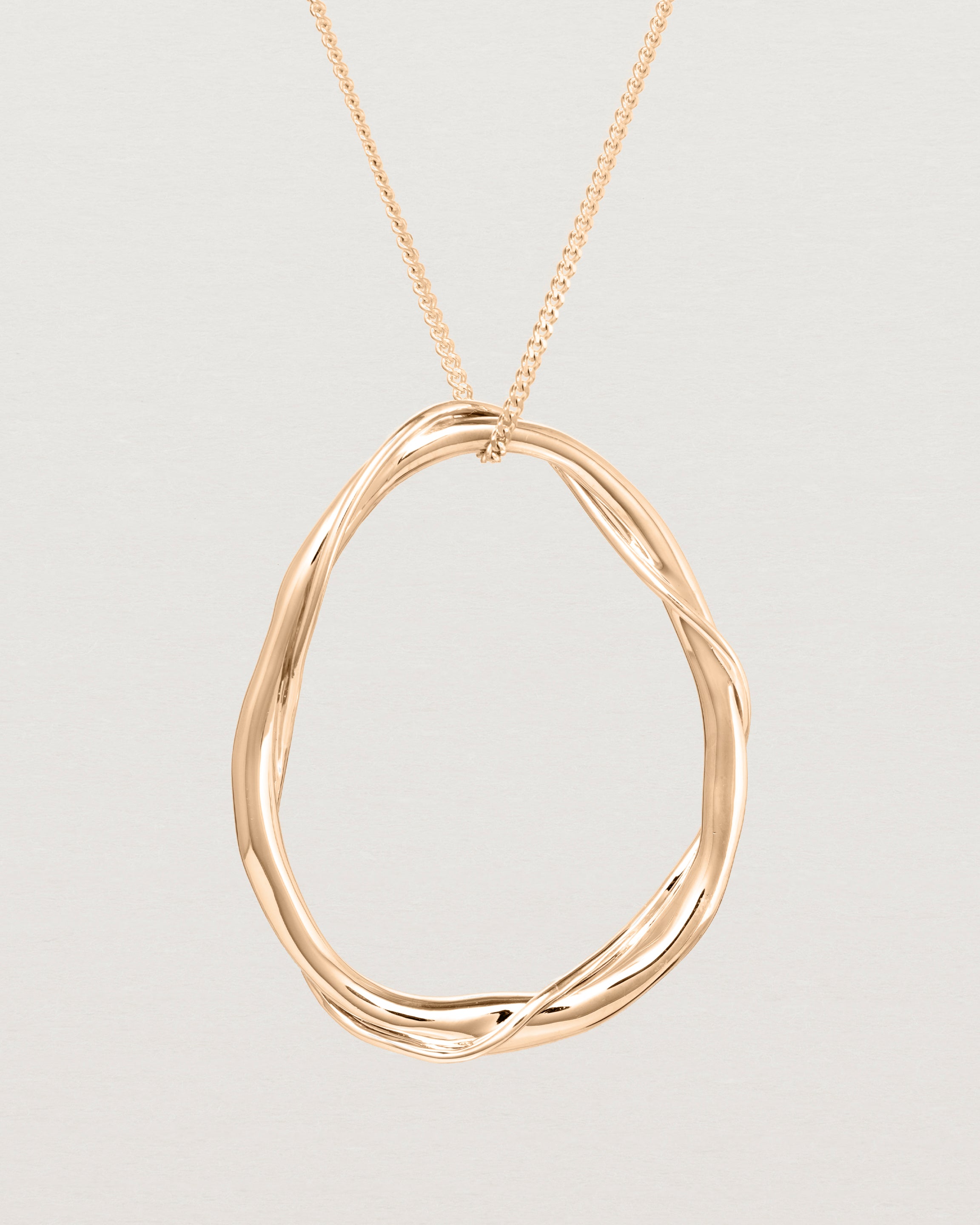 Close up view of the Dalí Necklace in rose gold.