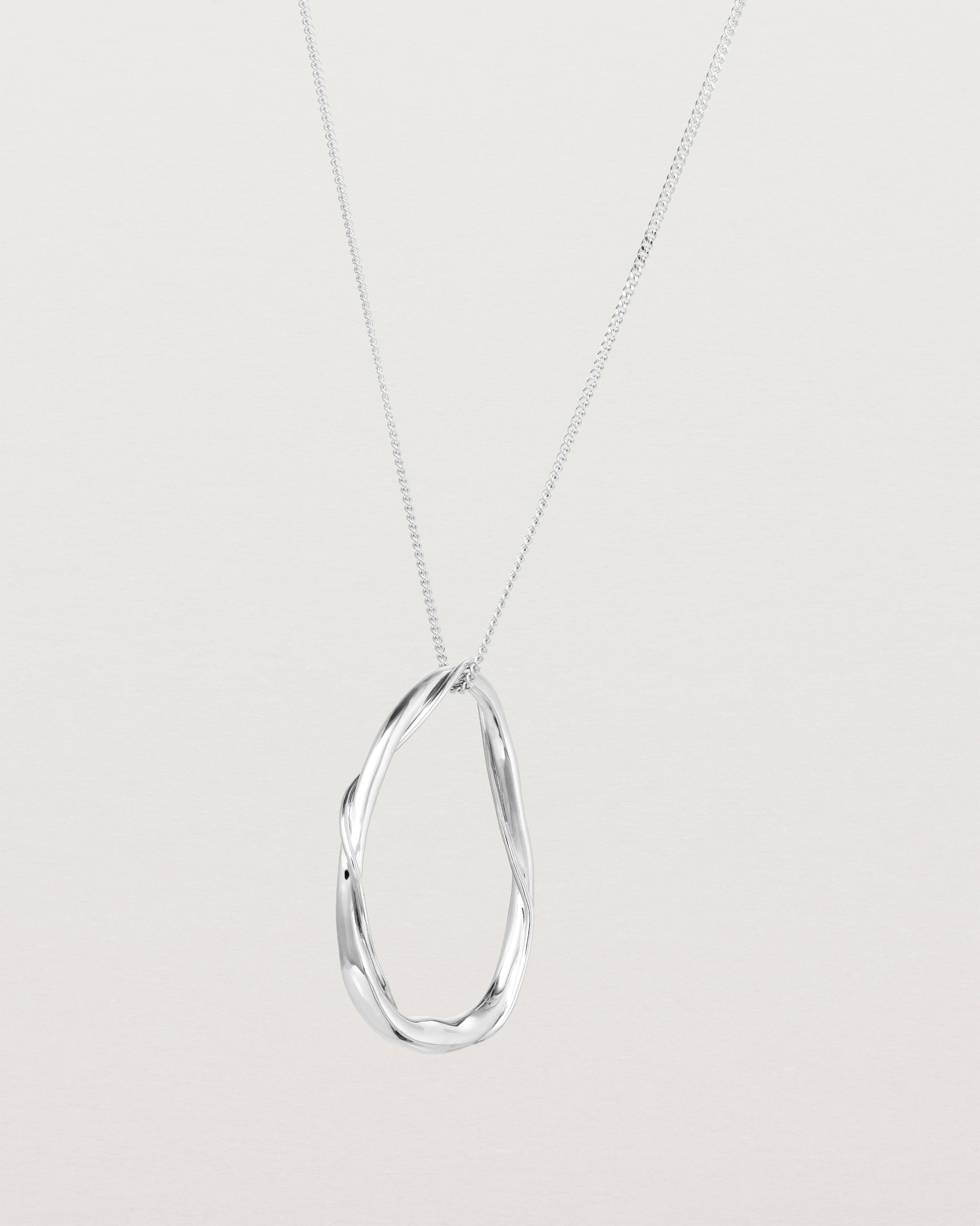 Angled view of the Dalí Necklace in sterling silver.