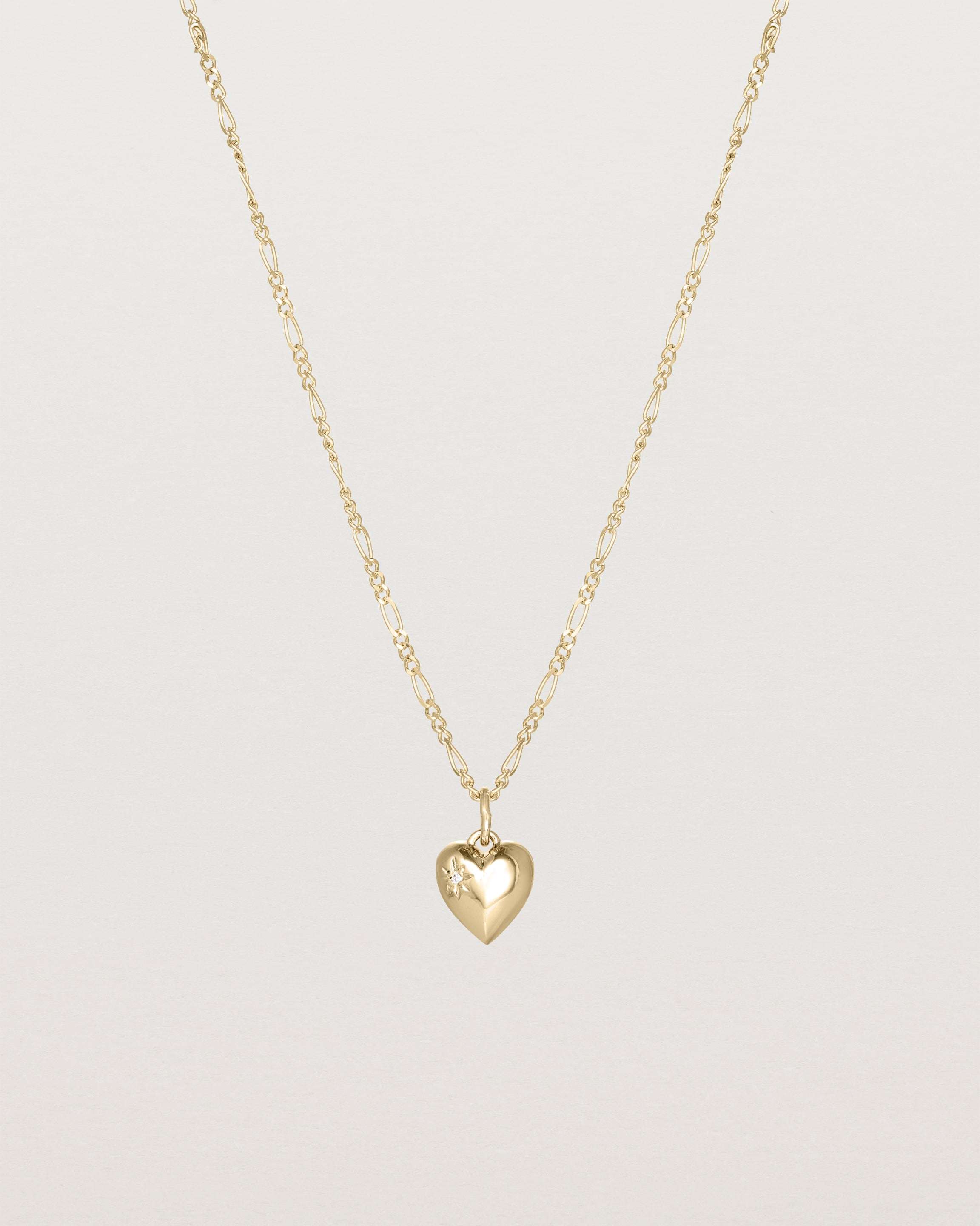 The Ella Necklace with a star set diamond birthstone in yellow gold