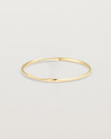 side view of the ellipse bangle in yellow gold
