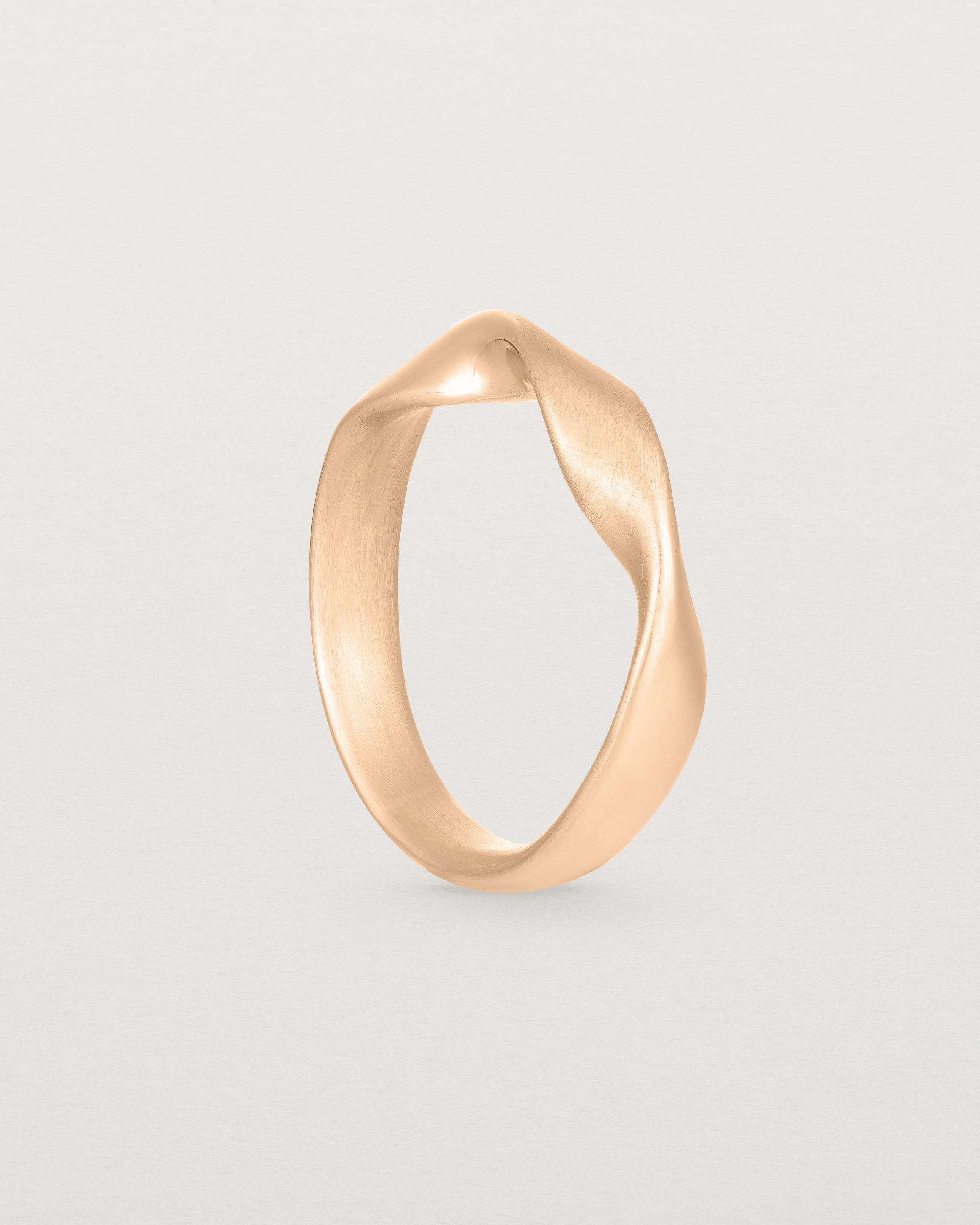 Standing view of the Ellipse / Shift Ring in Rose Gold.