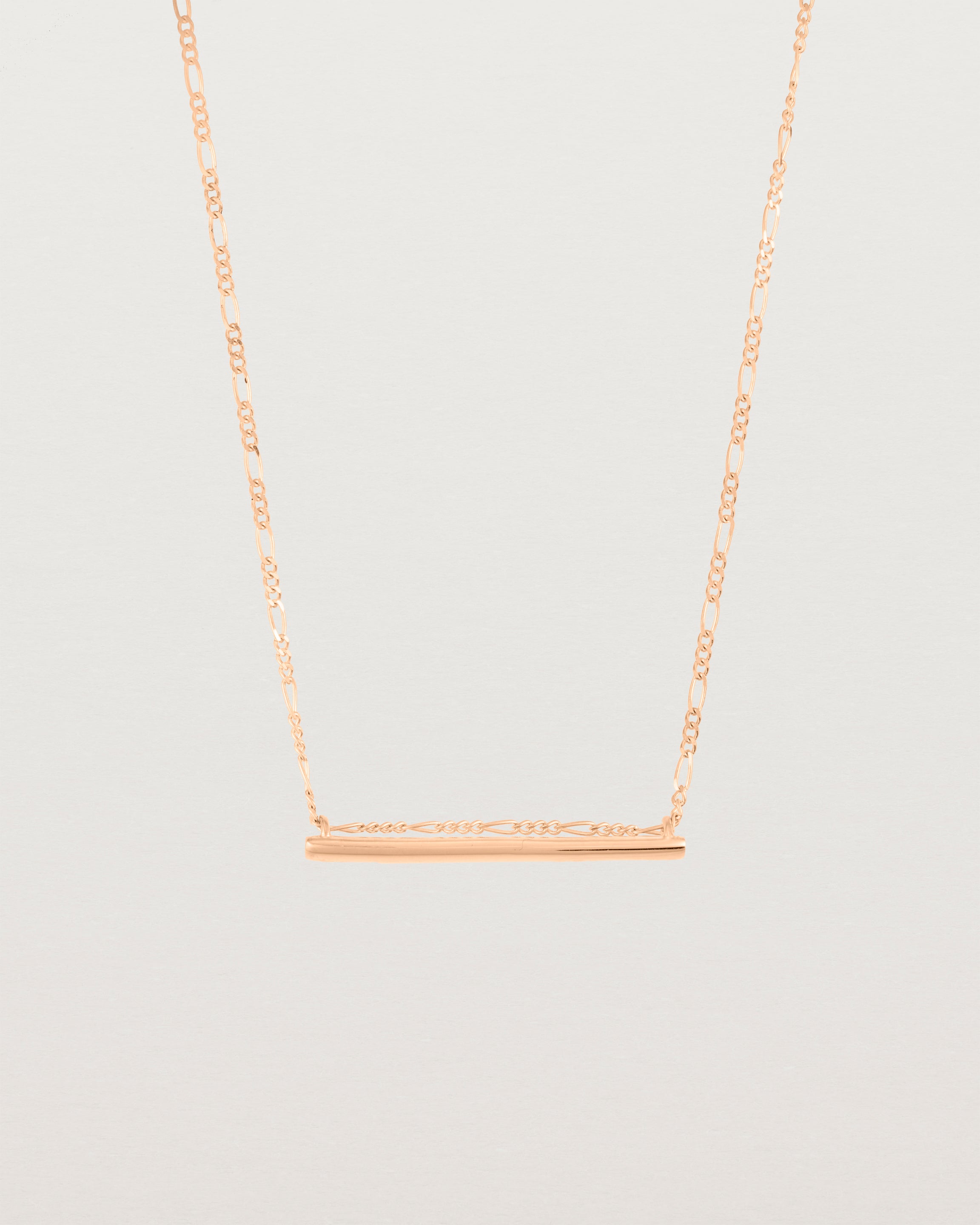 Ellipse necklace with a rose gold bar hanging from a chain in rose gold