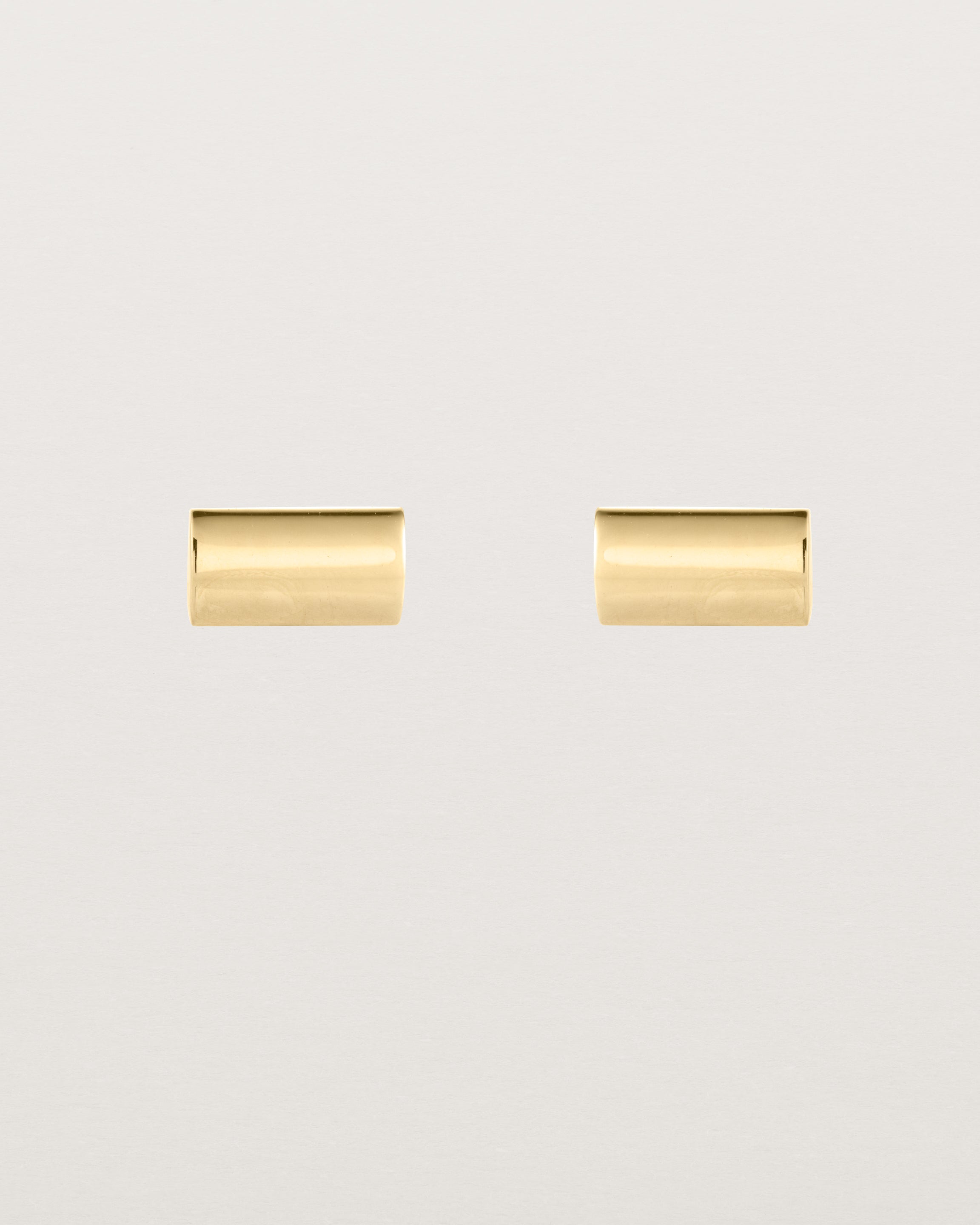 A pair of simple rectangle yellow gold studs
