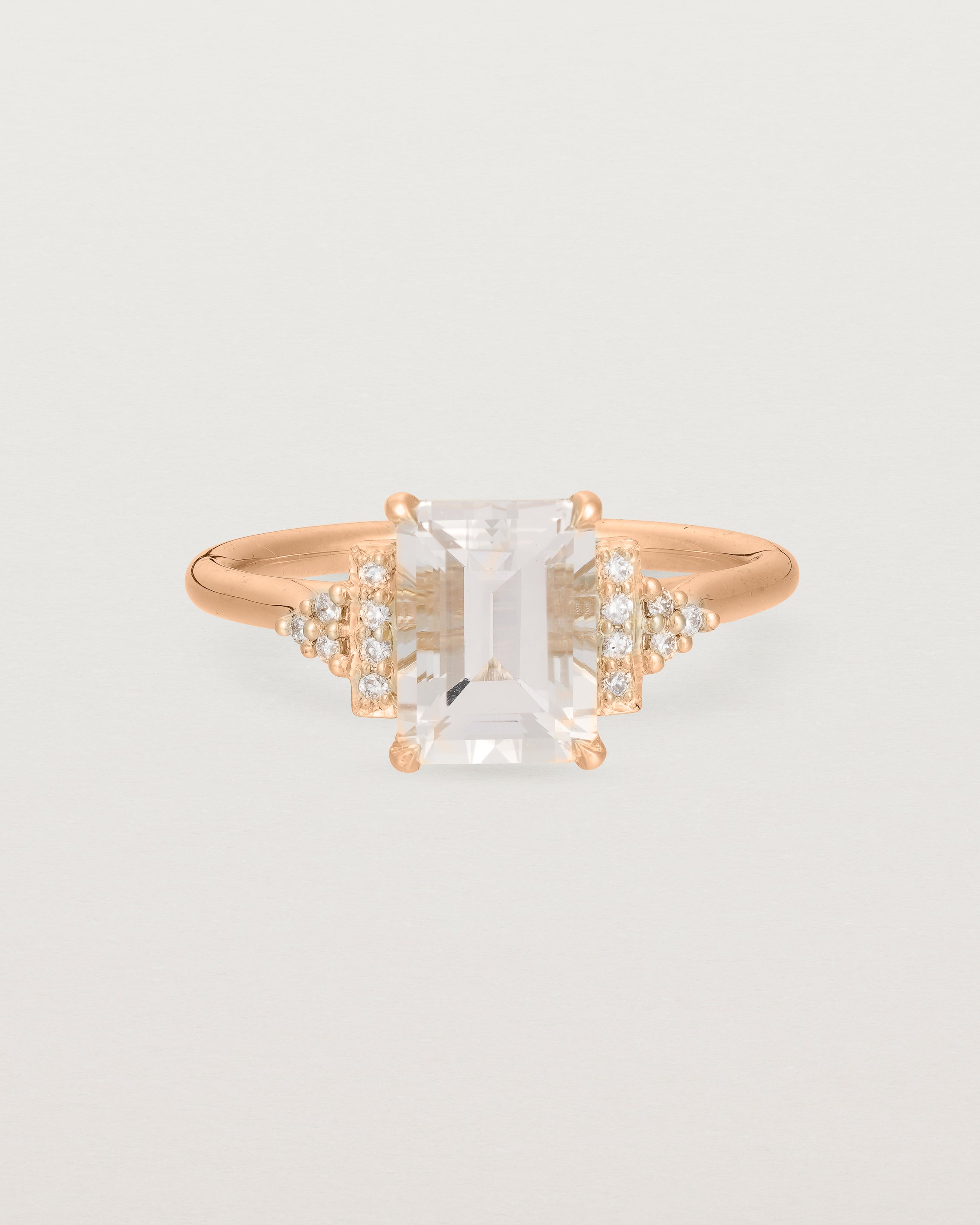 Front view of the Elodie Ring featuring a pale pink emerald cut morganite in rose gold