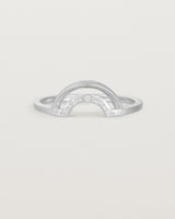 A double arc crown ring with white diamonds adoring the inner arc - crafted in white gold. 