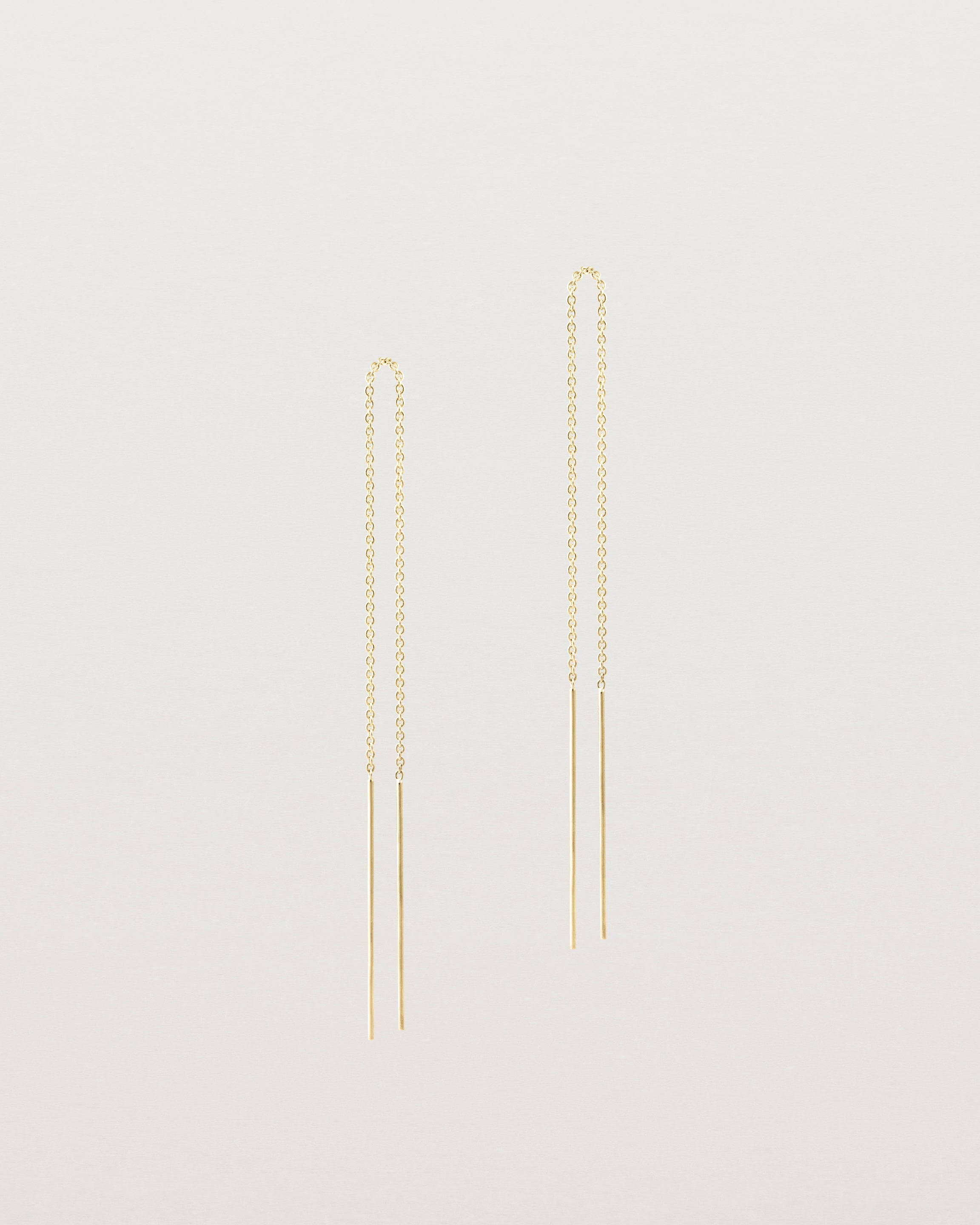 Front view of the eve threader earrings in yellow gold