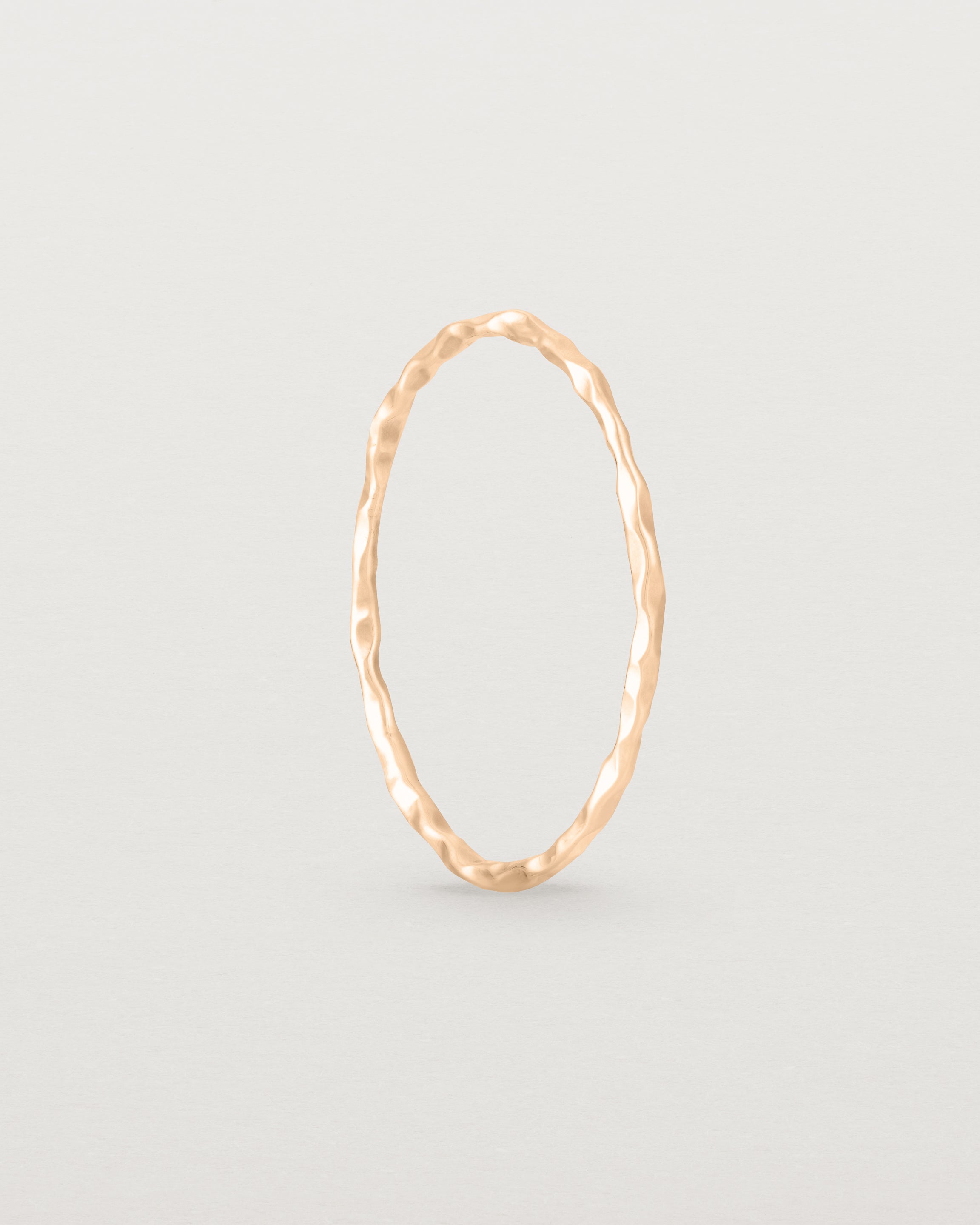 Standing view of the Fine Faceted Stacking Ring | Rose Gold.
