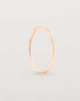 Standing view of the Fine Stacking Ring in rose gold.