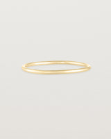 Front view of the Fine Stacking Ring in yellow gold.