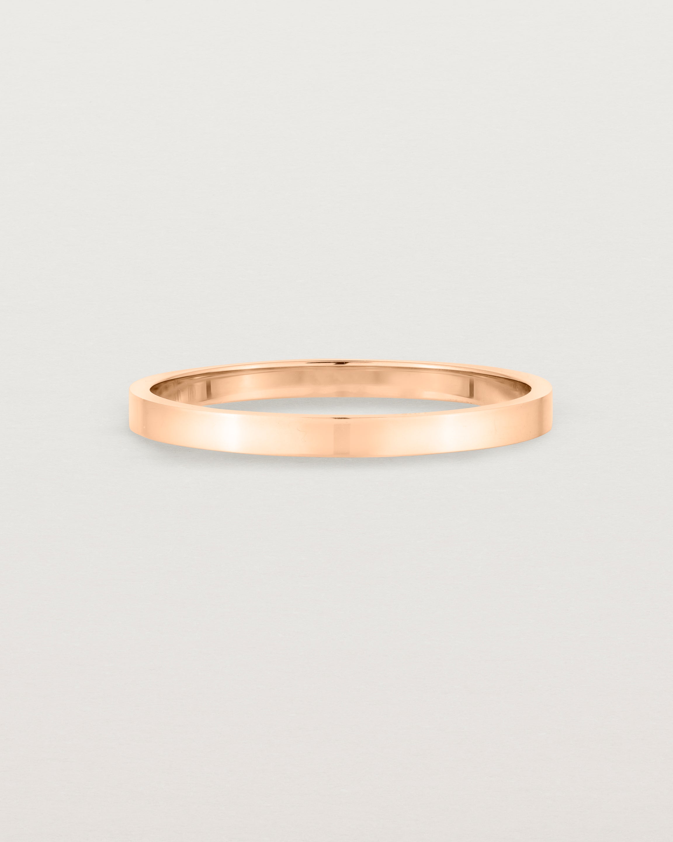 Our square profile, flat wedding band crafted in rose gold
