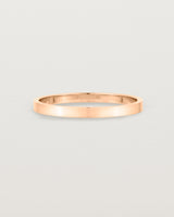 Our square profile, flat wedding band crafted in rose gold