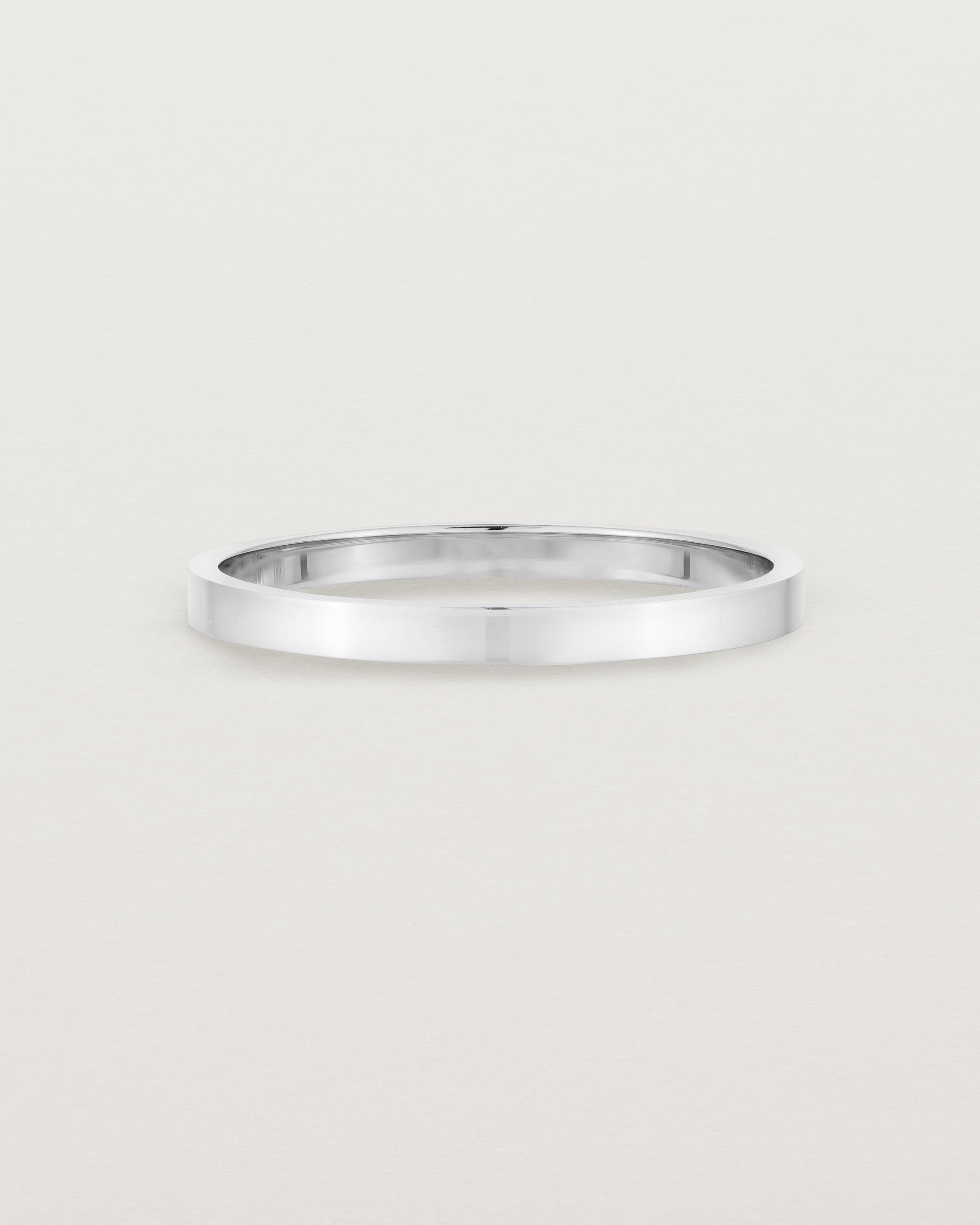 Our square profile, flat wedding band crafted in white gold