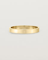 Our square, flat 3mm profile wedding band crafted in yellow gold