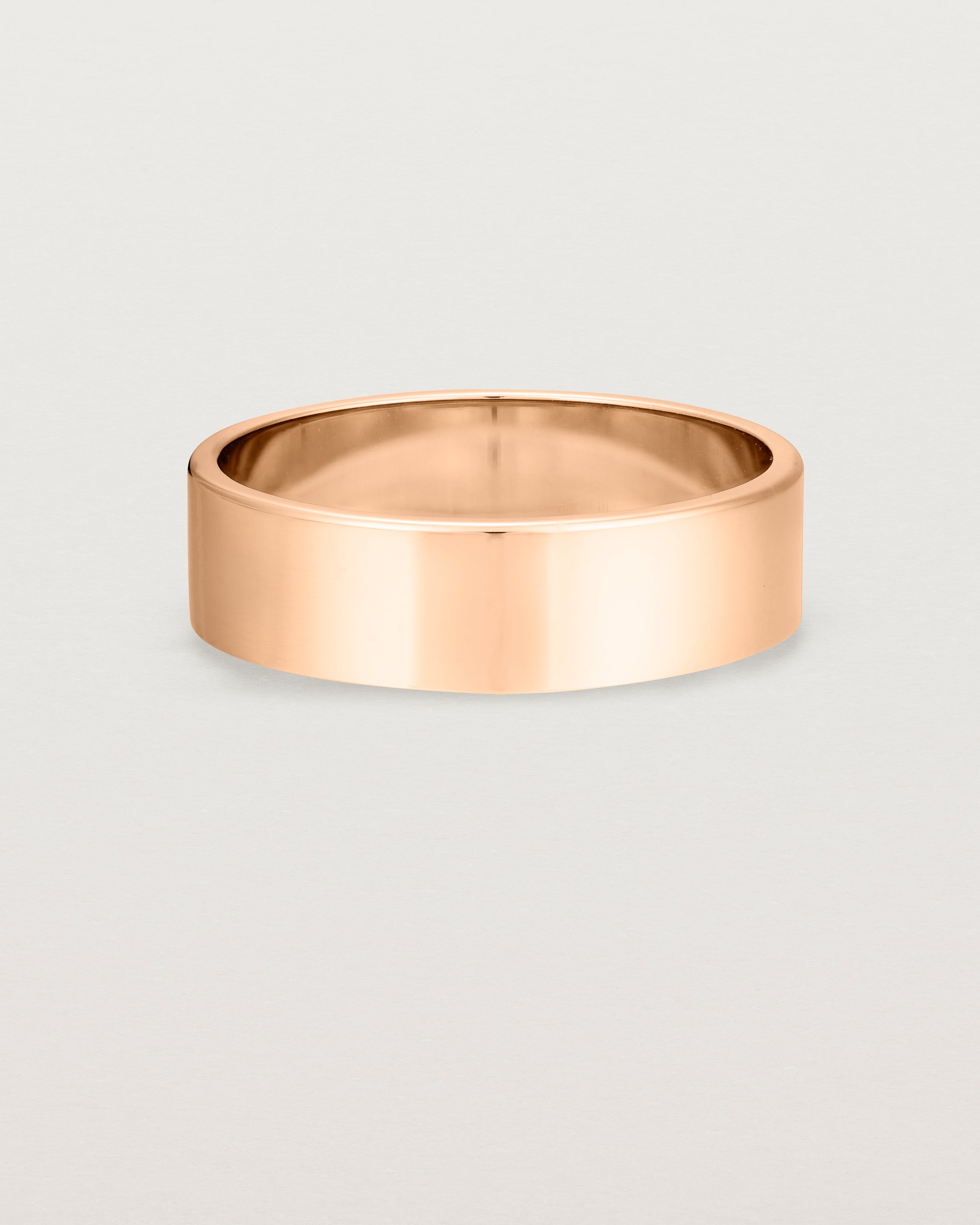 Our square profile, 6mm flat wedding band crafted in rose gold