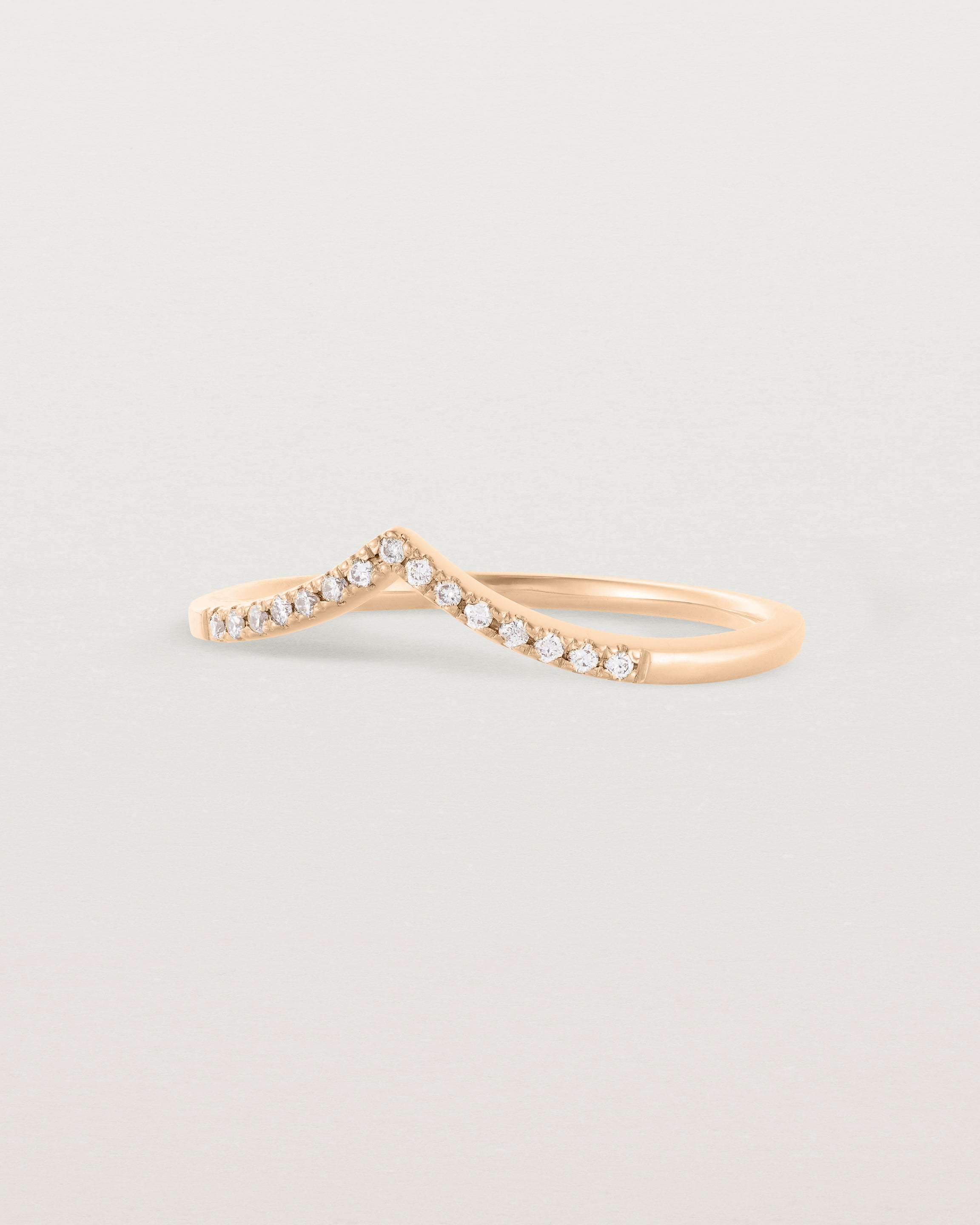 Side view of our white diamond gentle point ring in rose gold