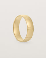 Standing view of the Grain Wedding Ring | 6mm | Yellow Gold.