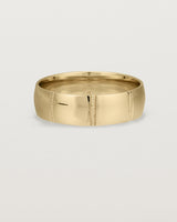 Front view of the Grain Wedding Ring | 6mm | Yellow Gold.