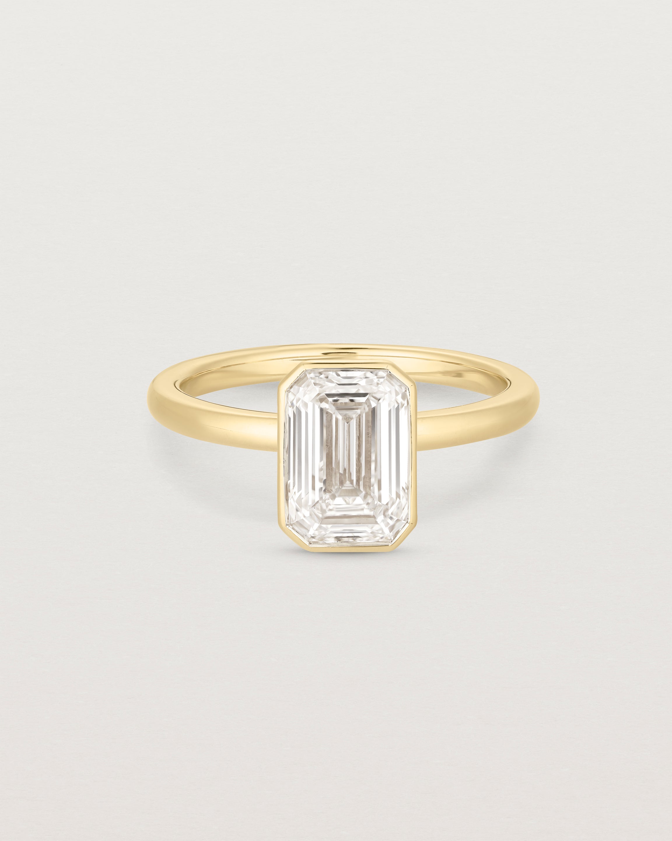 Emerald Cut Bezel Solitaire | Natural Diamond