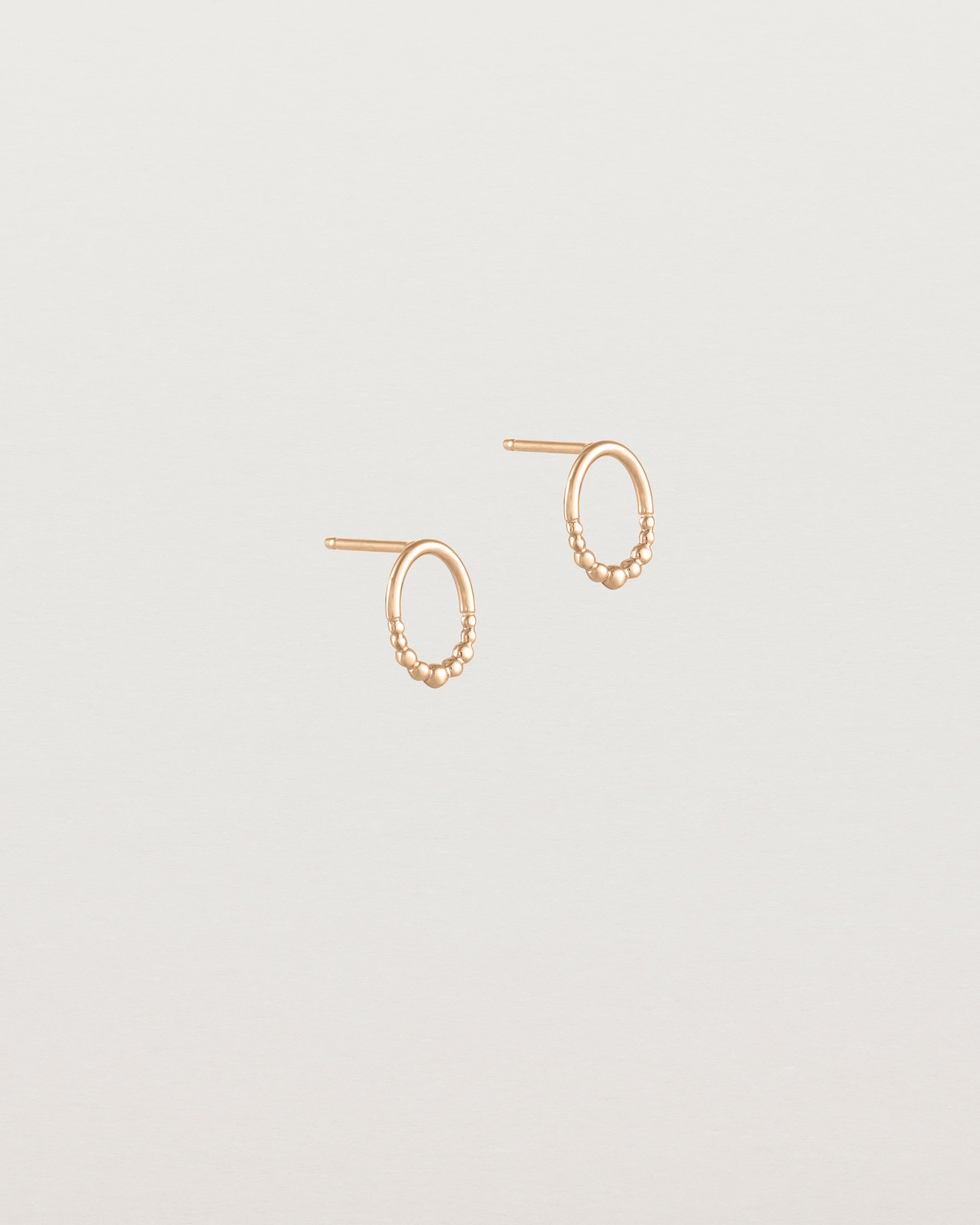 Angled view of the Indra Studs in rose gold.