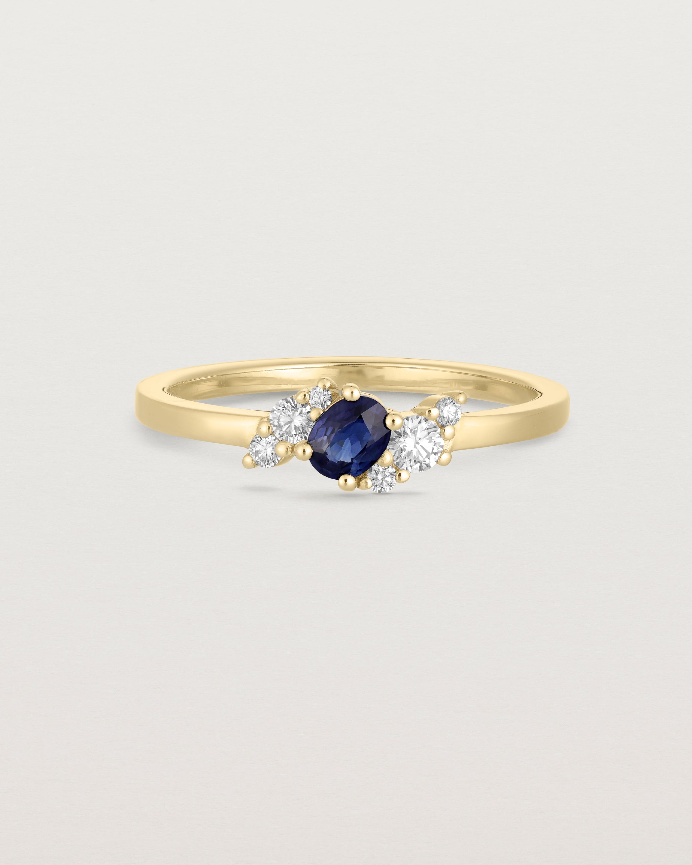 deep etched image of a a yellow gold engagement ring with a cluster of diamonds