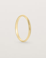 Standing view of the Knife Edge Wedding Ring | 2mm | Yellow Gold.
