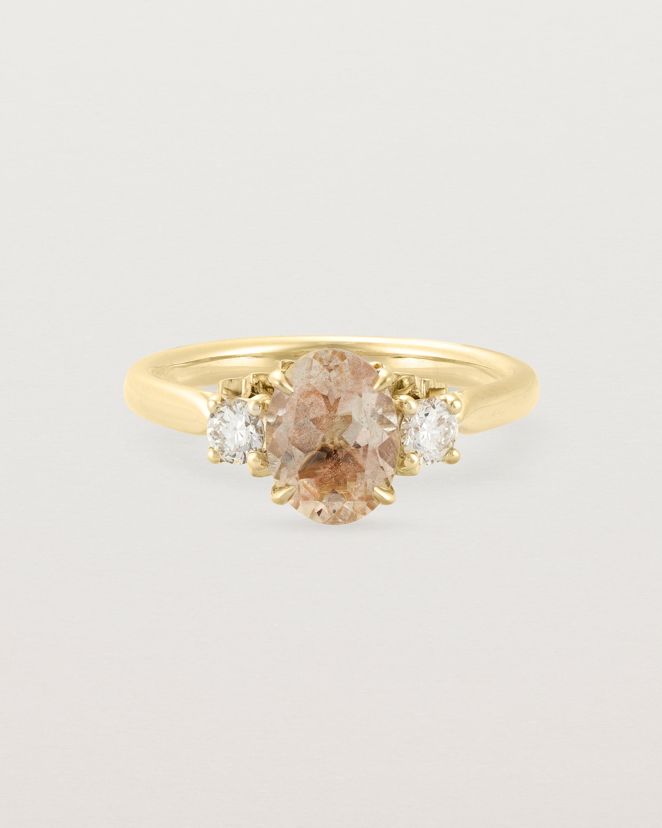 Front view of the Laurel Oval Trio Ring | Savannah Sunstone | Yellow Gold.