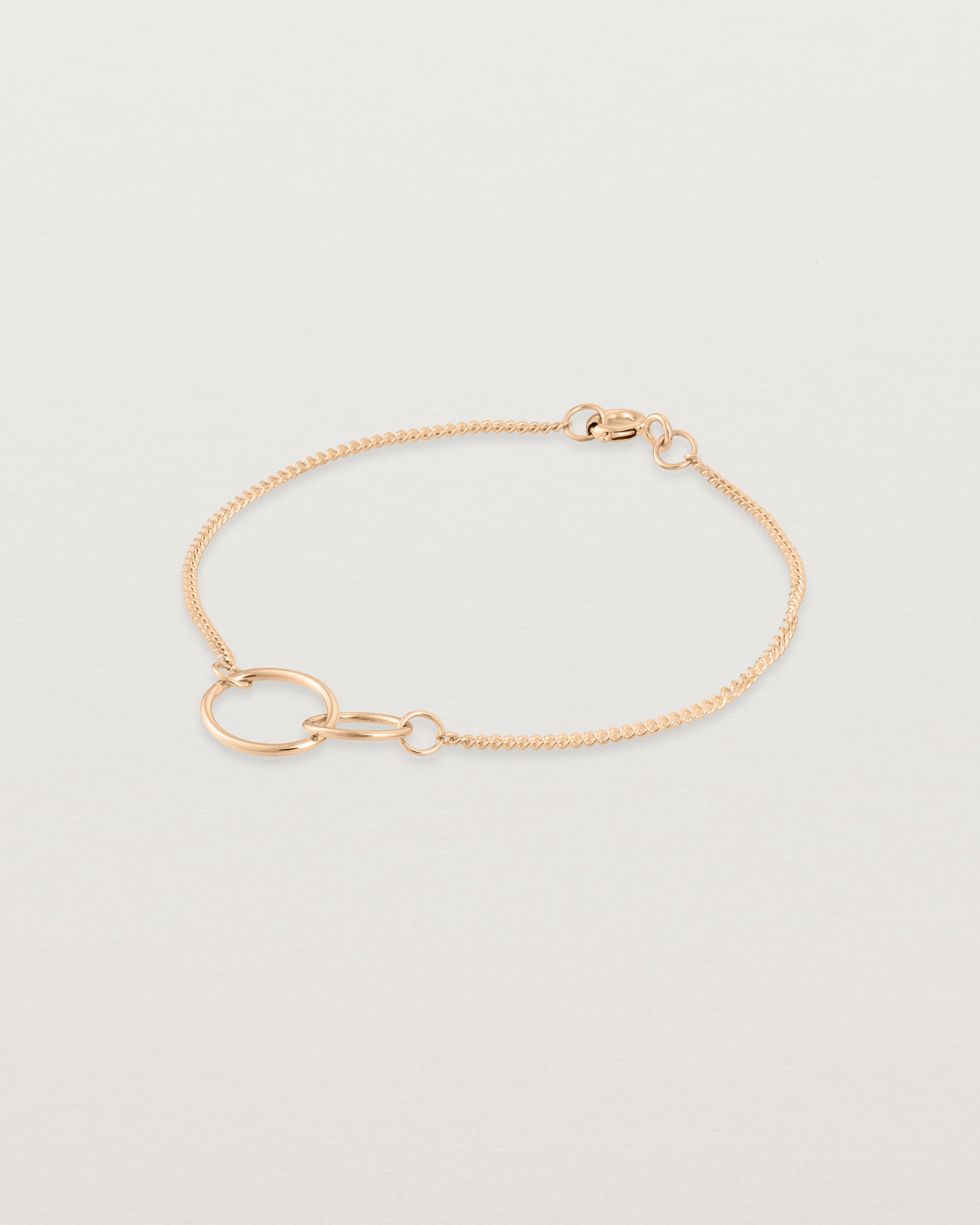 side view of the loop through oval bracelet in rose gold