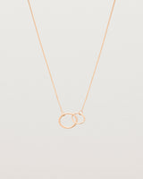 two circles interlinking on a rose gold necklace