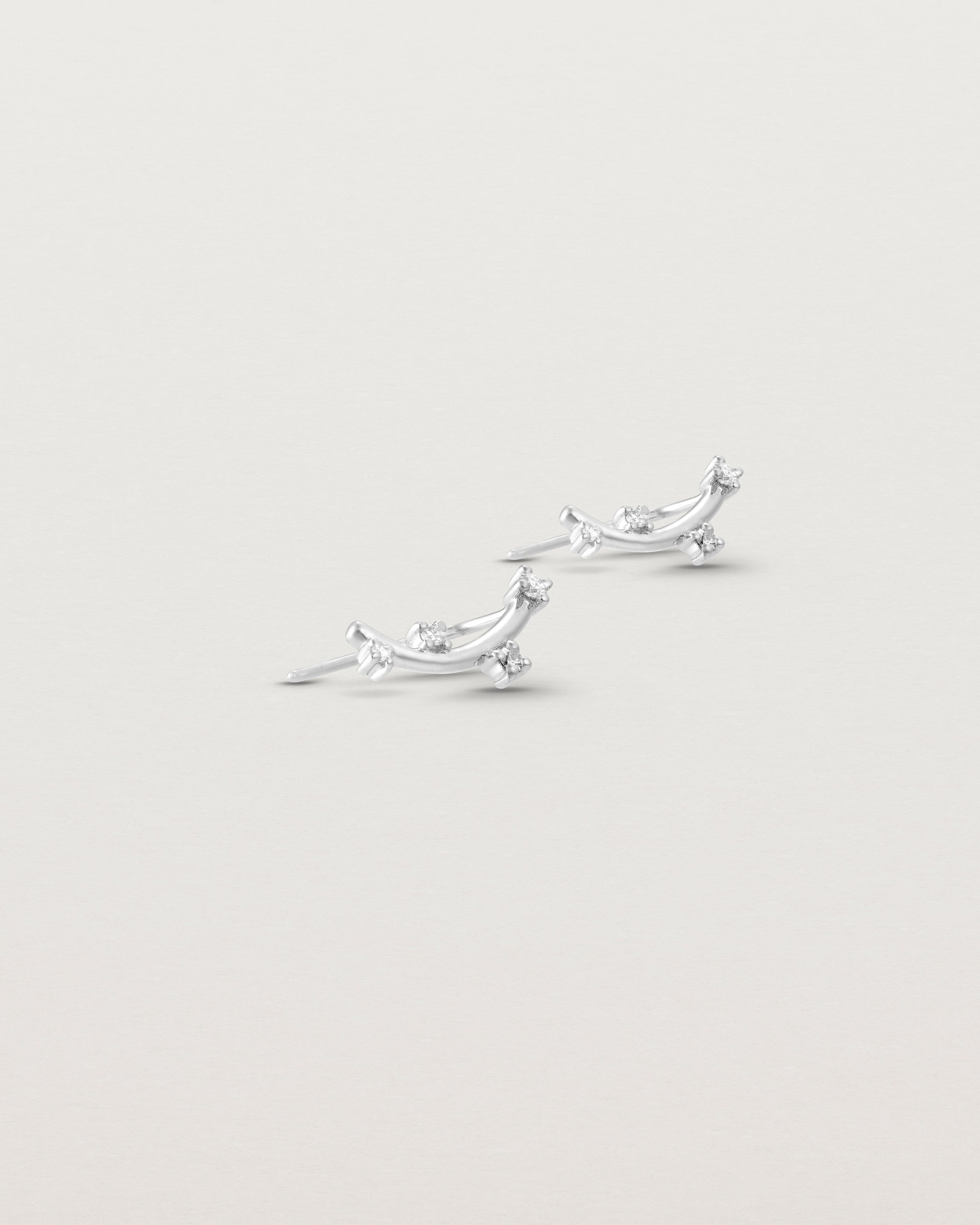 Angled view of the Lyra Earrings | Diamond in white gold.