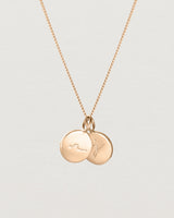 Close up view of the Mae Necklace with 2 pendants in rose gold.